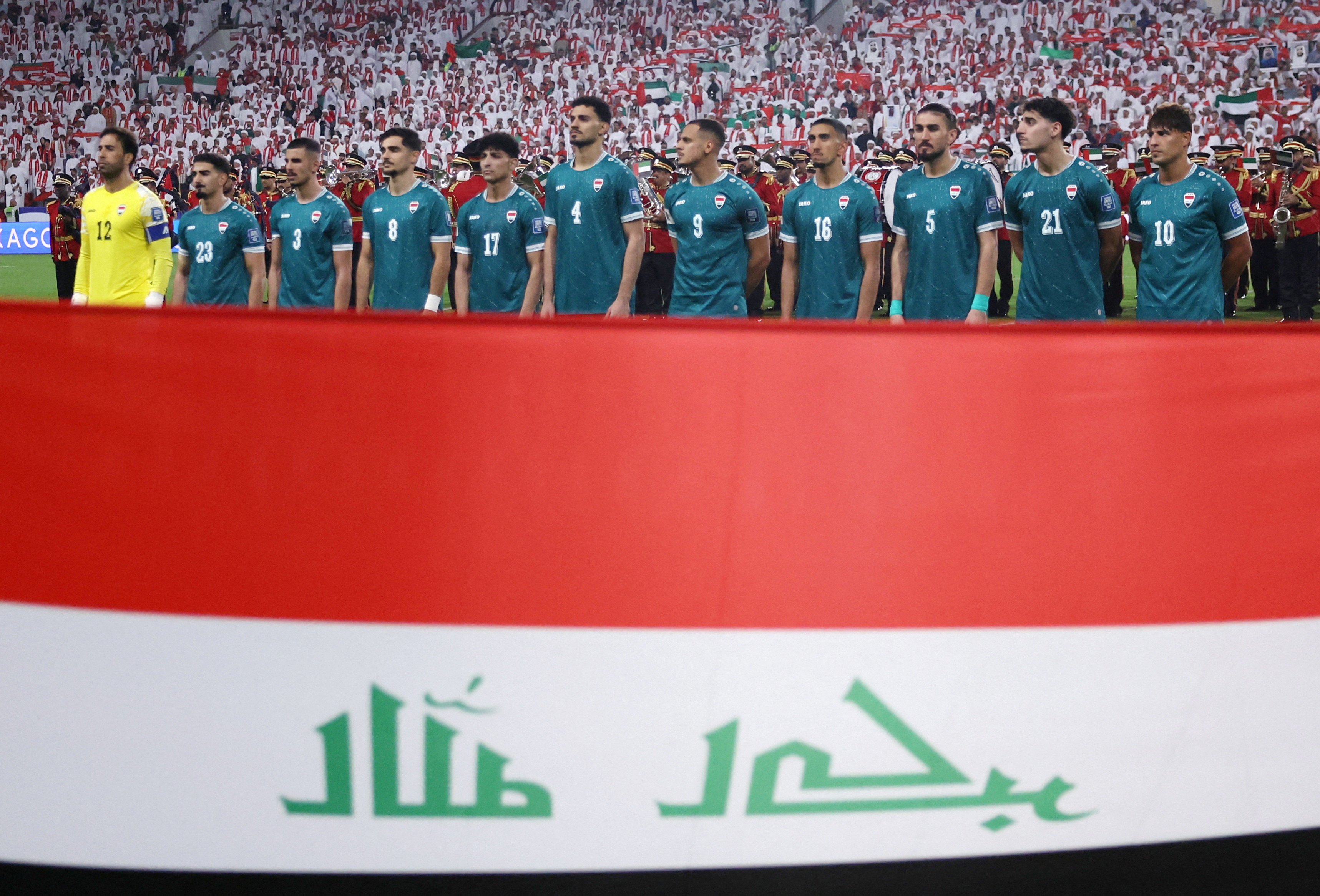 Iraq men's football team with its national flag.