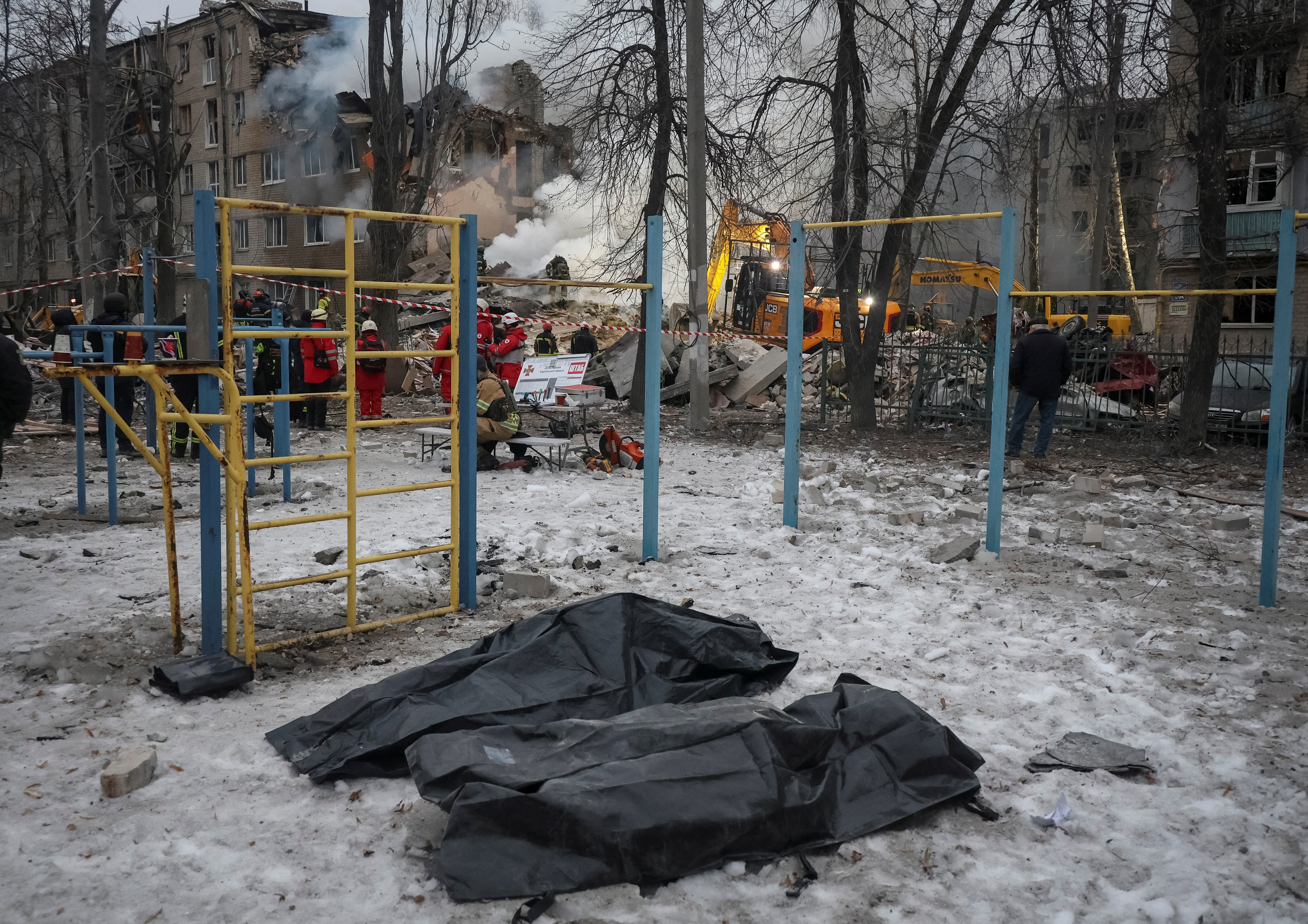 Bags with bodies of persons found under debris of an apartment building which was hit during overnight Russian missile strikes, amid Russia's attack on Ukraine, in Kharkiv, Ukraine March 7, 2026. REUTERS/Vyacheslav Madiyevskyy TPX IMAGES OF THE DAY