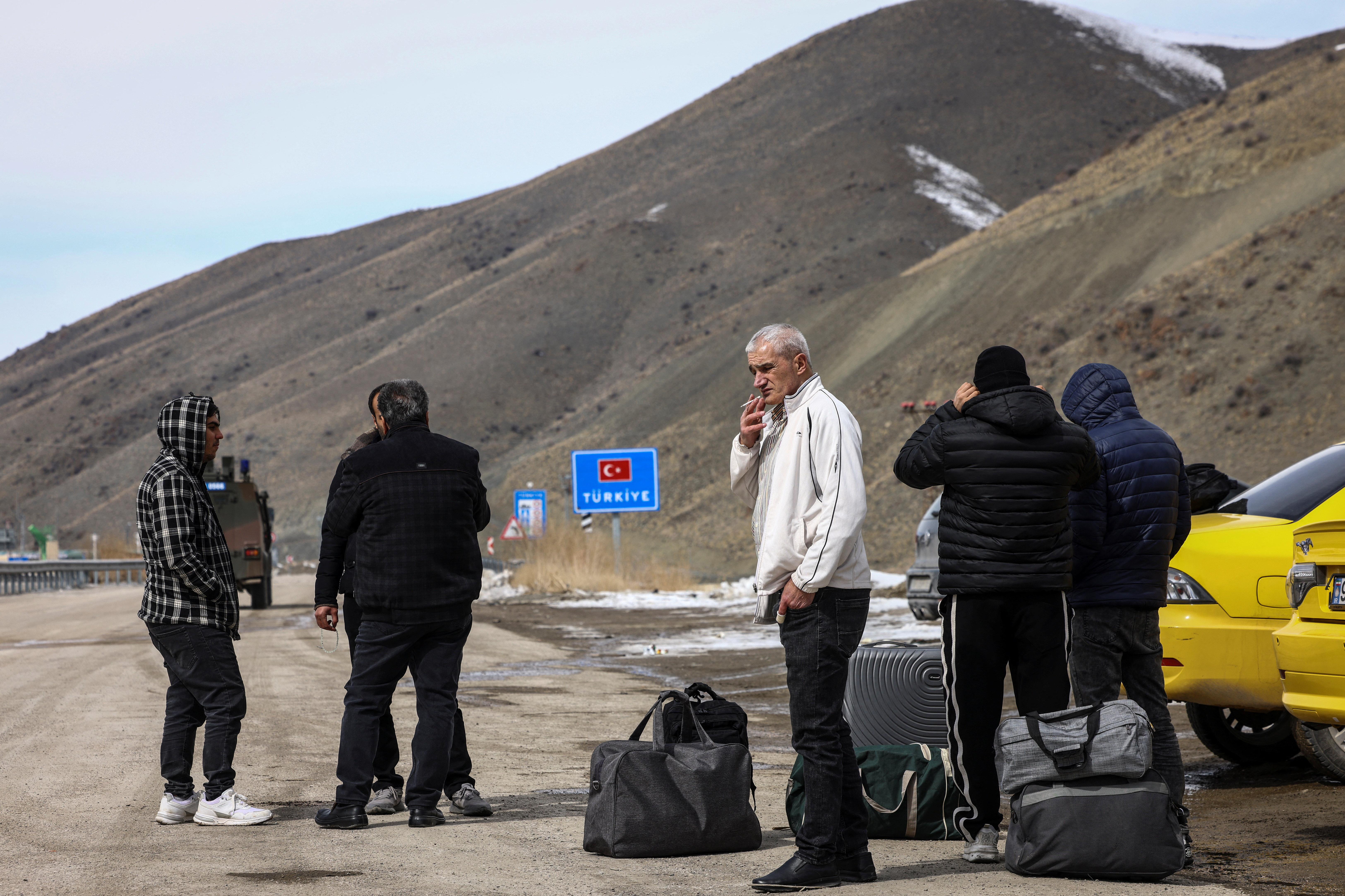 Iranians make their way after crossing into Turkey at the Kapikoy Border Gate in the eastern Van province