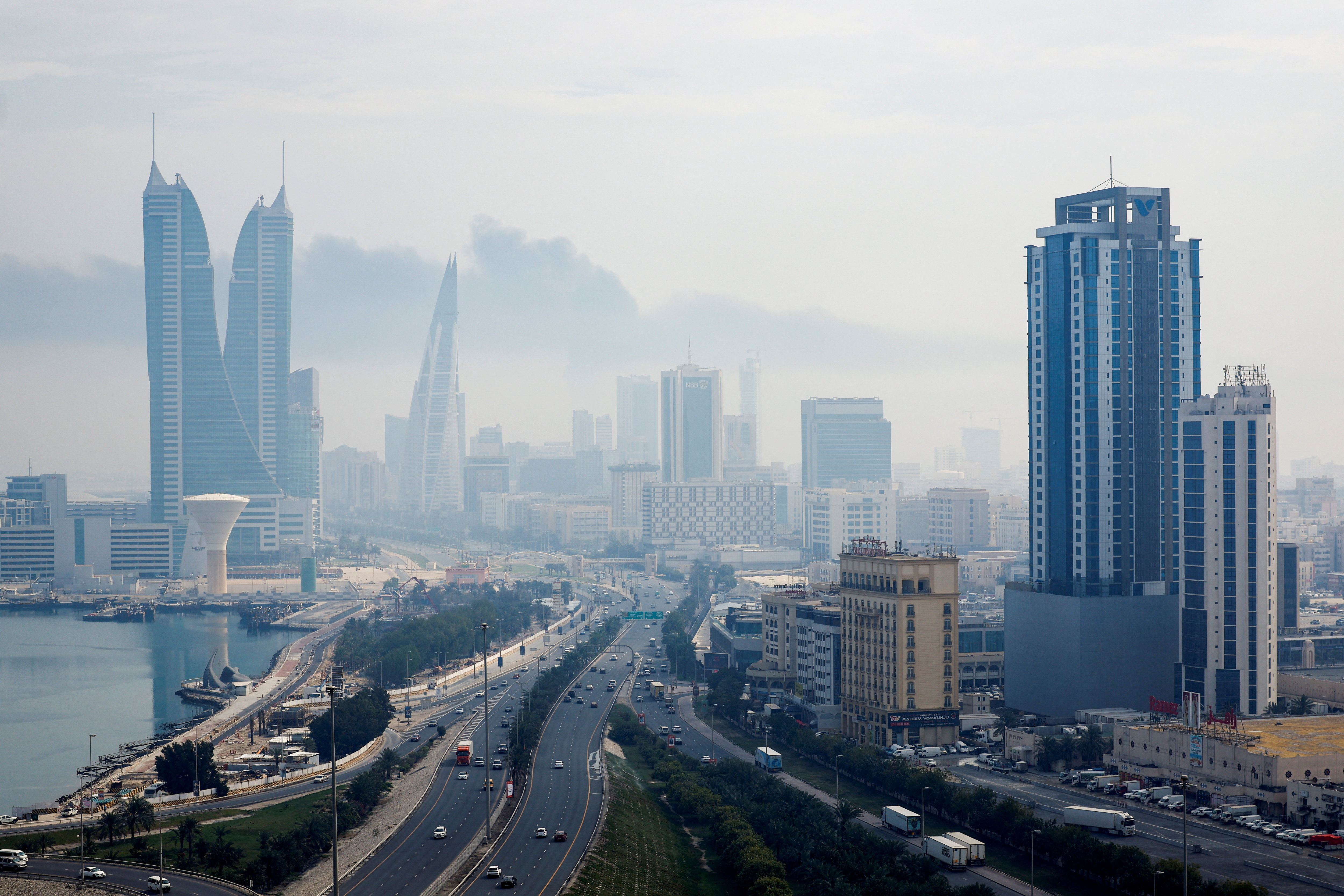 Smoke rises over the capital Manama,