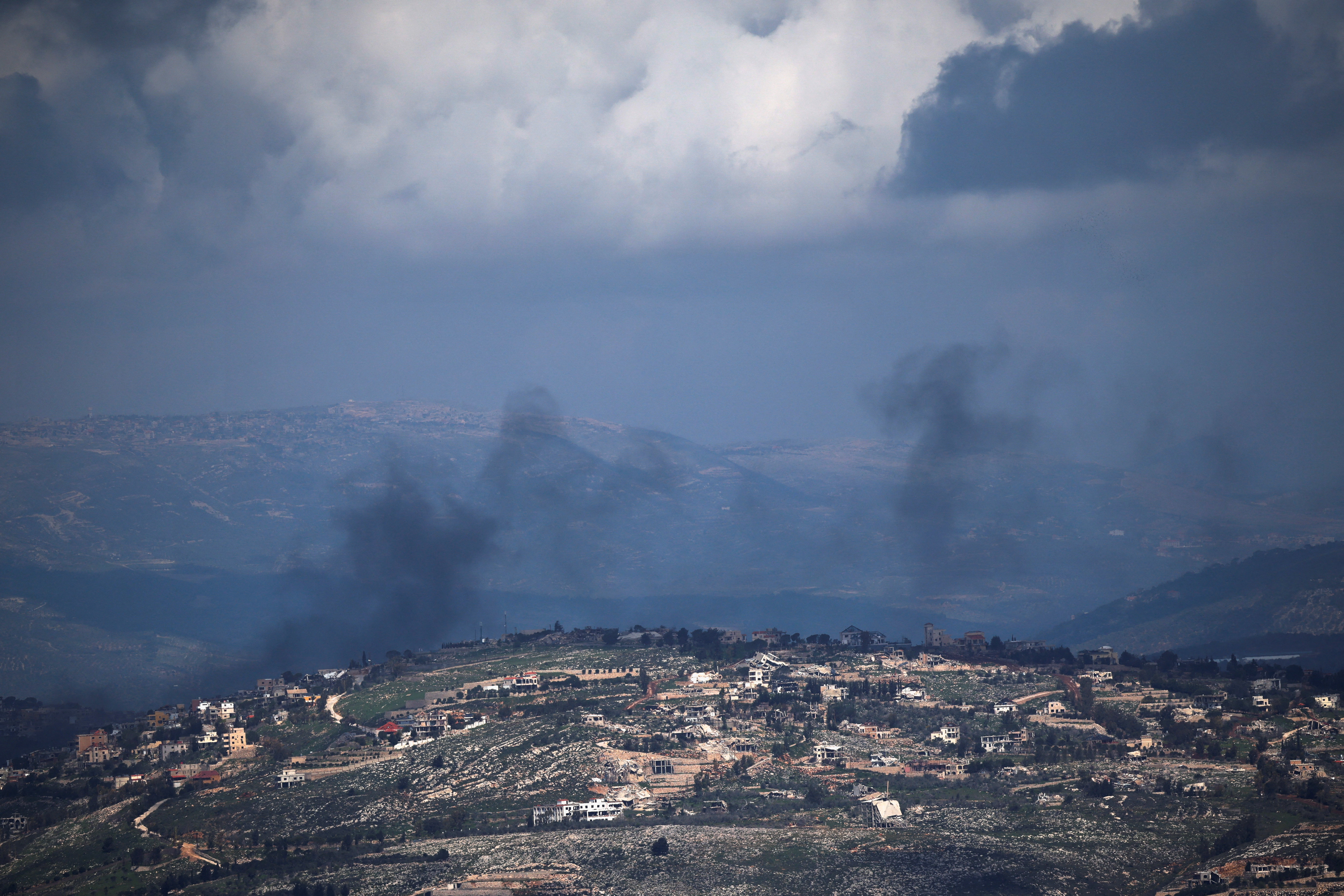 Smoke rises from a village in Lebanon following an Israeli strike, amid escalation between Hezbollah and Israel,