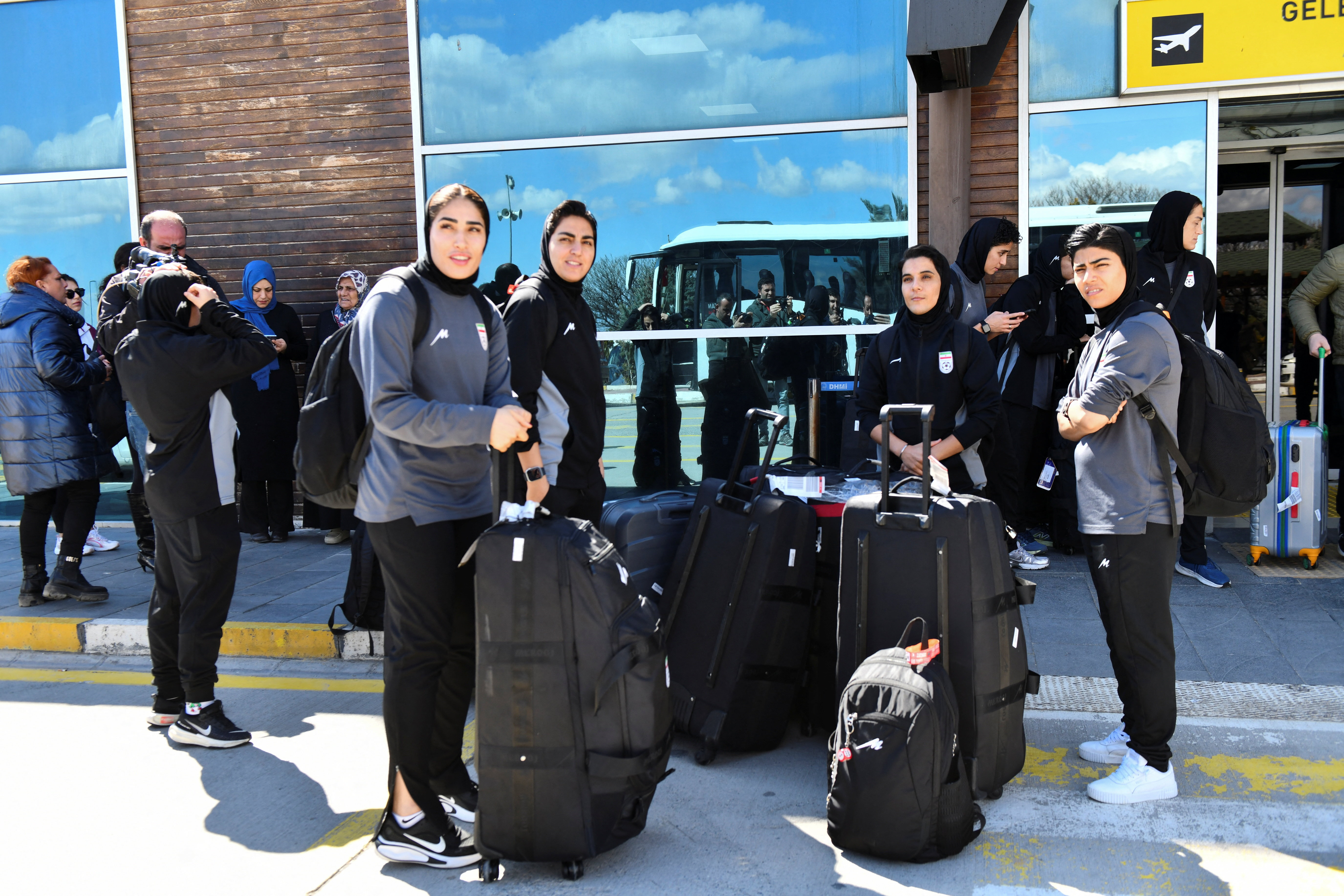 Members of the Iranian women's national football team outside the airport after they arrived in Igdir, Turkiye, from Australia