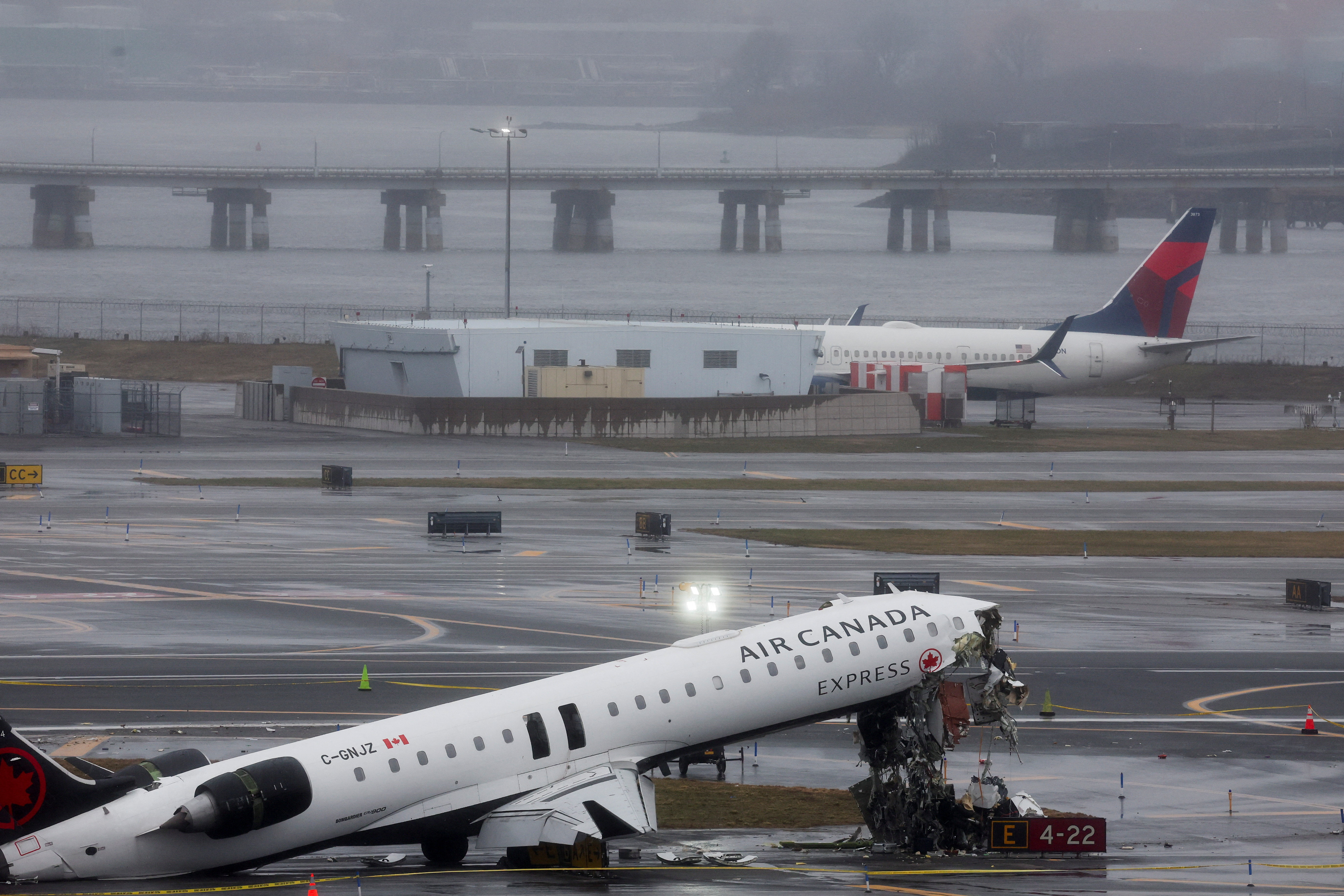 The wreckage of an Air Canada Express jet that collided with a ground vehicle at New York's LaGuardia airport