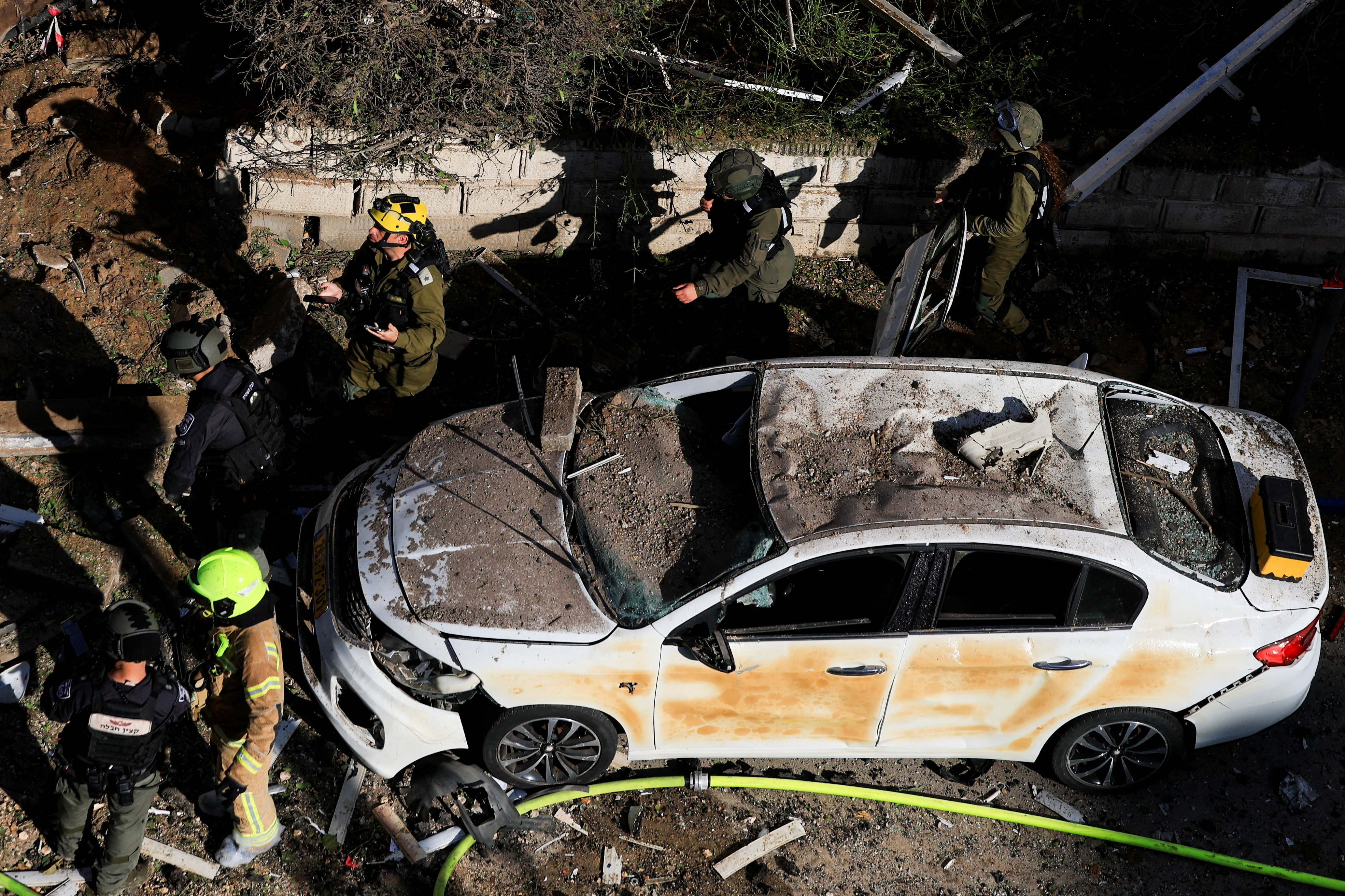 This picture shows damaged buildings at the site of an Iranian missile strike in Tel Aviv