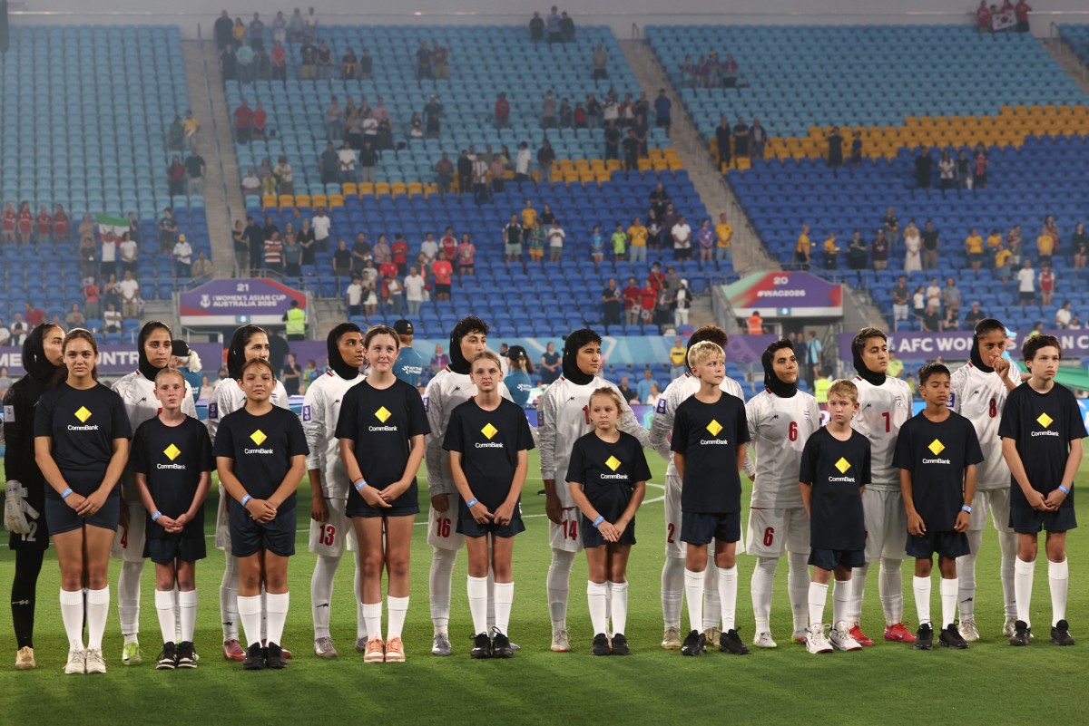 Team Iran listen national anthems before the AFC Womens Asian Cup Australia 2026 football match between South Korea and Iran in Gold Coast on March 2, 2026. (Photo by Izhar Khan / AFP) / -- IMAGE RESTRICTED TO EDITORIAL USE - STRICTLY NO COMMERCIAL USE --