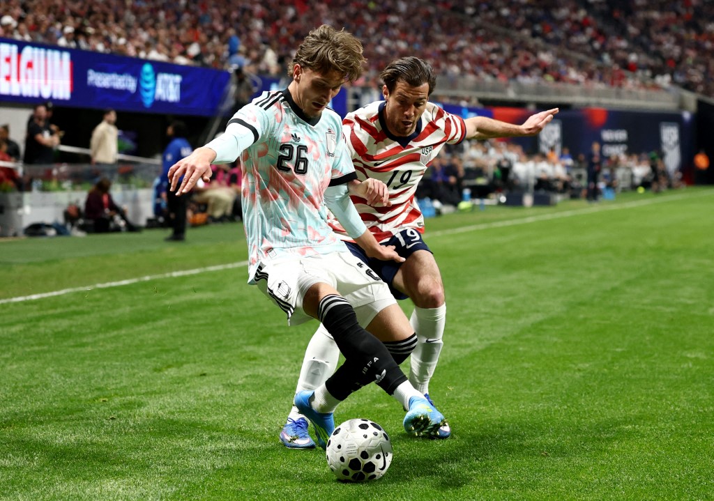 Mika Godts of Belgium is challenged by Joe Scally of the USA during an International Friendly match in Atlanta