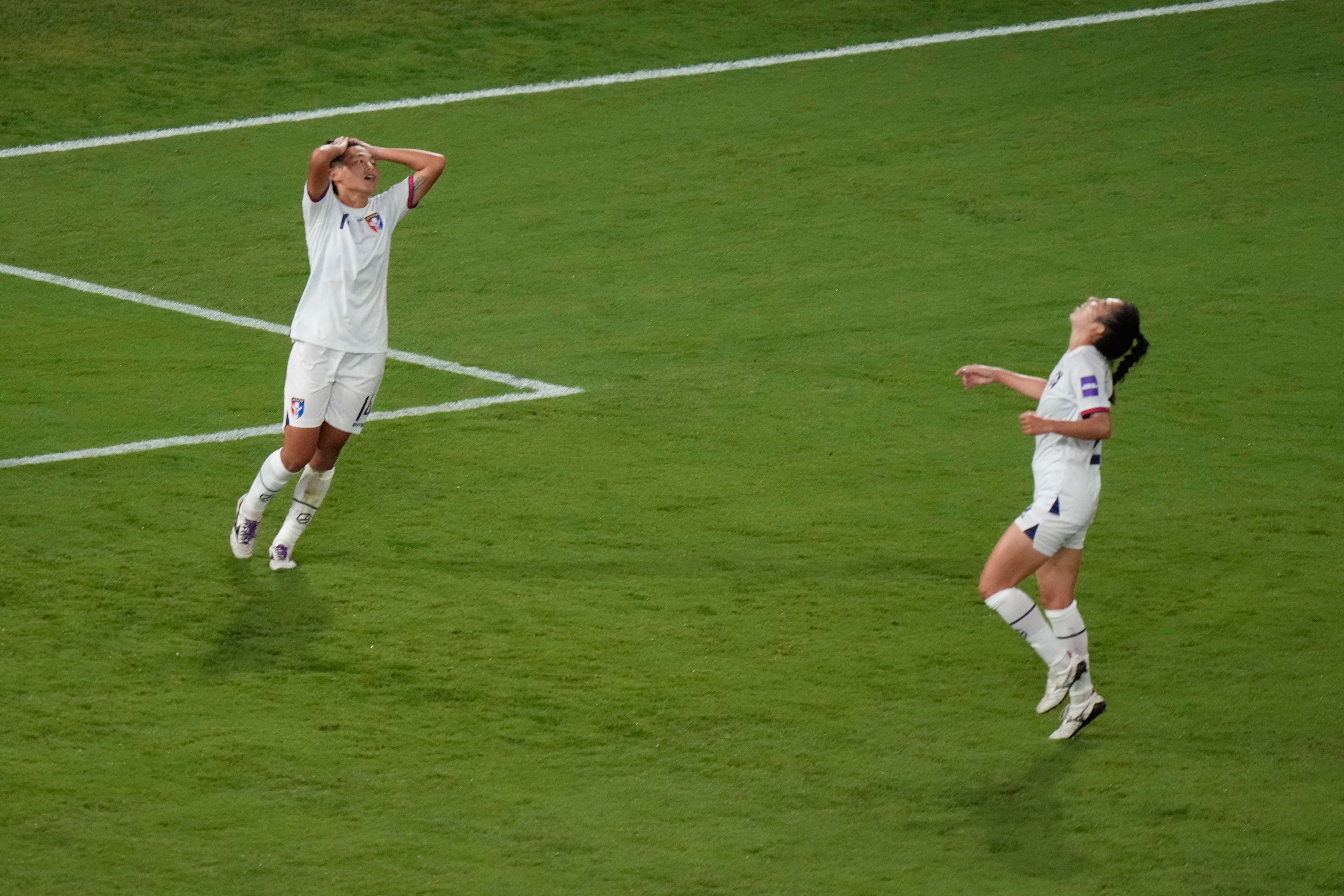 Taiwan's Wu Kai Ching, left, reacts after missing a chance to score during the Women's Asian Cup soccer match between India and Taiwan