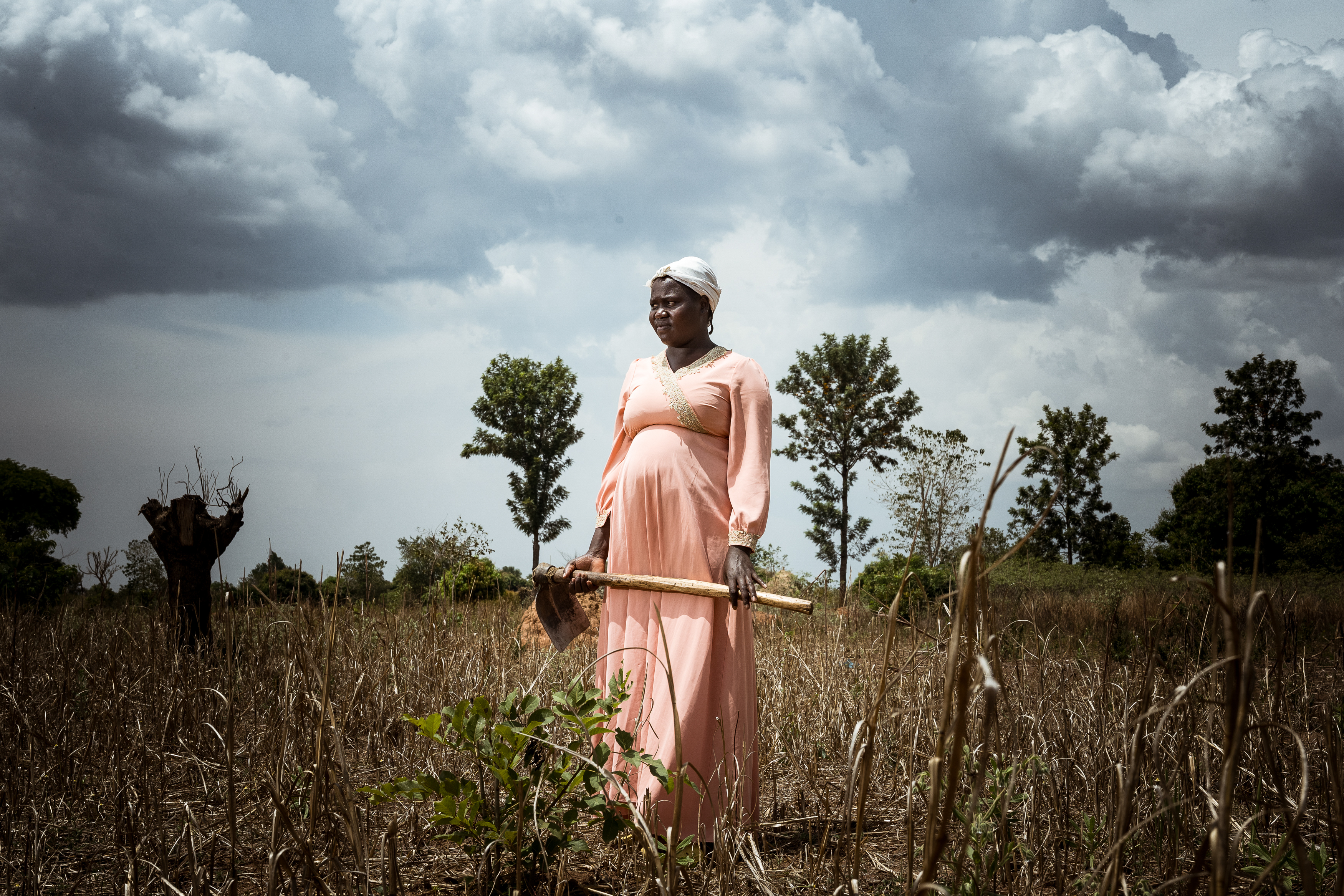 9th February 2026. Owalai, Uganda. Martha Apolot, 21. Martha is the single mother of Aaron Elayu, 8. Aaron lives with an undiagnosed disability and is cared for solely by his young mother Martha after she fell pregnant in dubious circumstances at age 13. She has been shunned by her family and recieves little assistance from them. She earns a meagre amount of money by performing casual agricultural jobs, such as weeding ,for neighbouring property owners. Photograph by Christopher Hopkins