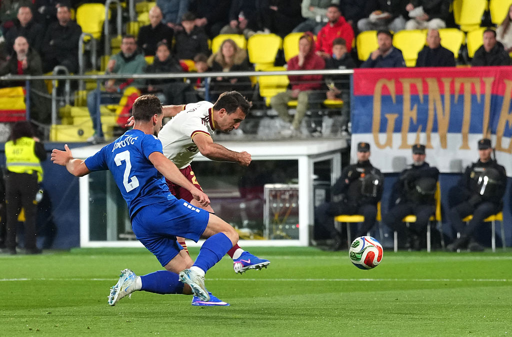Mikel Oyarzabal of Spain scores his team's first goal under pressure from Ognjen Mimovic of Serbia during the International Friendly match between Spain and Serbia