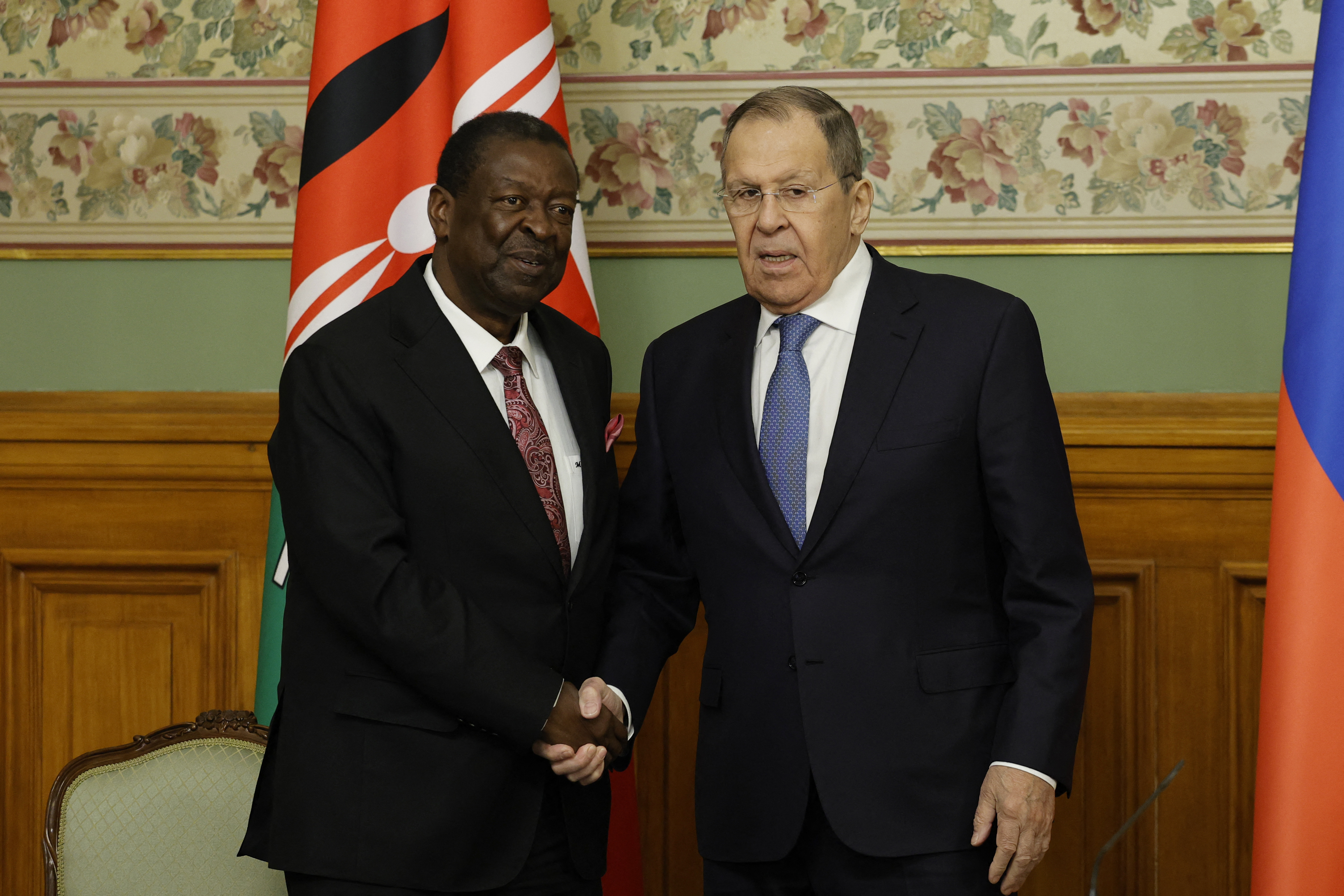 Russia's Foreign Minister Sergei Lavrov (R) shakes hands with Kenya's Foreign Minister Musalia Mudavadi (L) during a joint press conference following their talks in Moscow on March 16, 2026. (Photo by TATYANA MAKEYEVA / POOL / AFP)