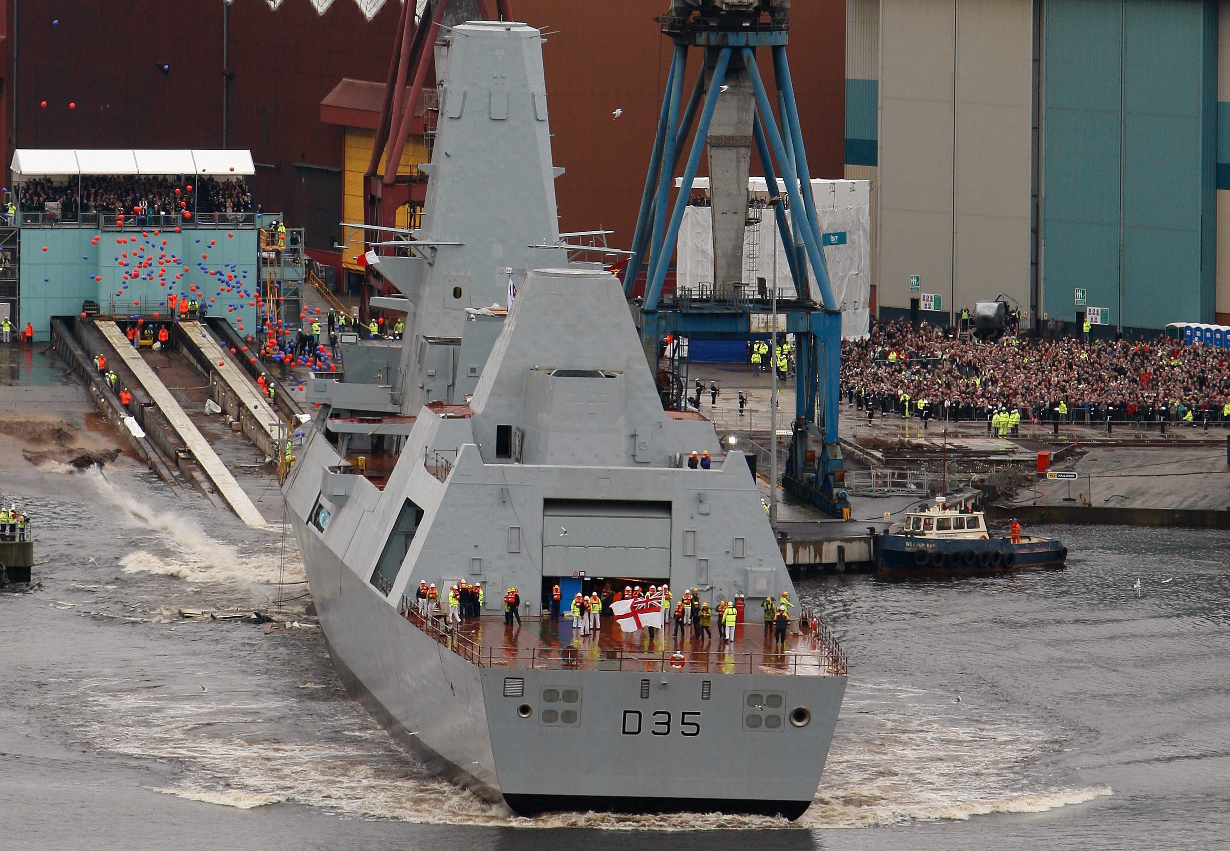GLASGOW, UNITED KINGDOM - NOVEMBER 17: HMS Dragon is the fourth of the new Type 45 class of air defence destroyers to be built at the BAE Systems shipyard is launched on the Clyde as part of a £6bn programme, November 17, 2008 in Glasgow, Scotland. Six destroyers in total have been commissioned to be built and launched in Glasgow, securing work at the Clyde shipyard for the next 15 years. (Photo by Jeff J Mitchell/Getty Images)