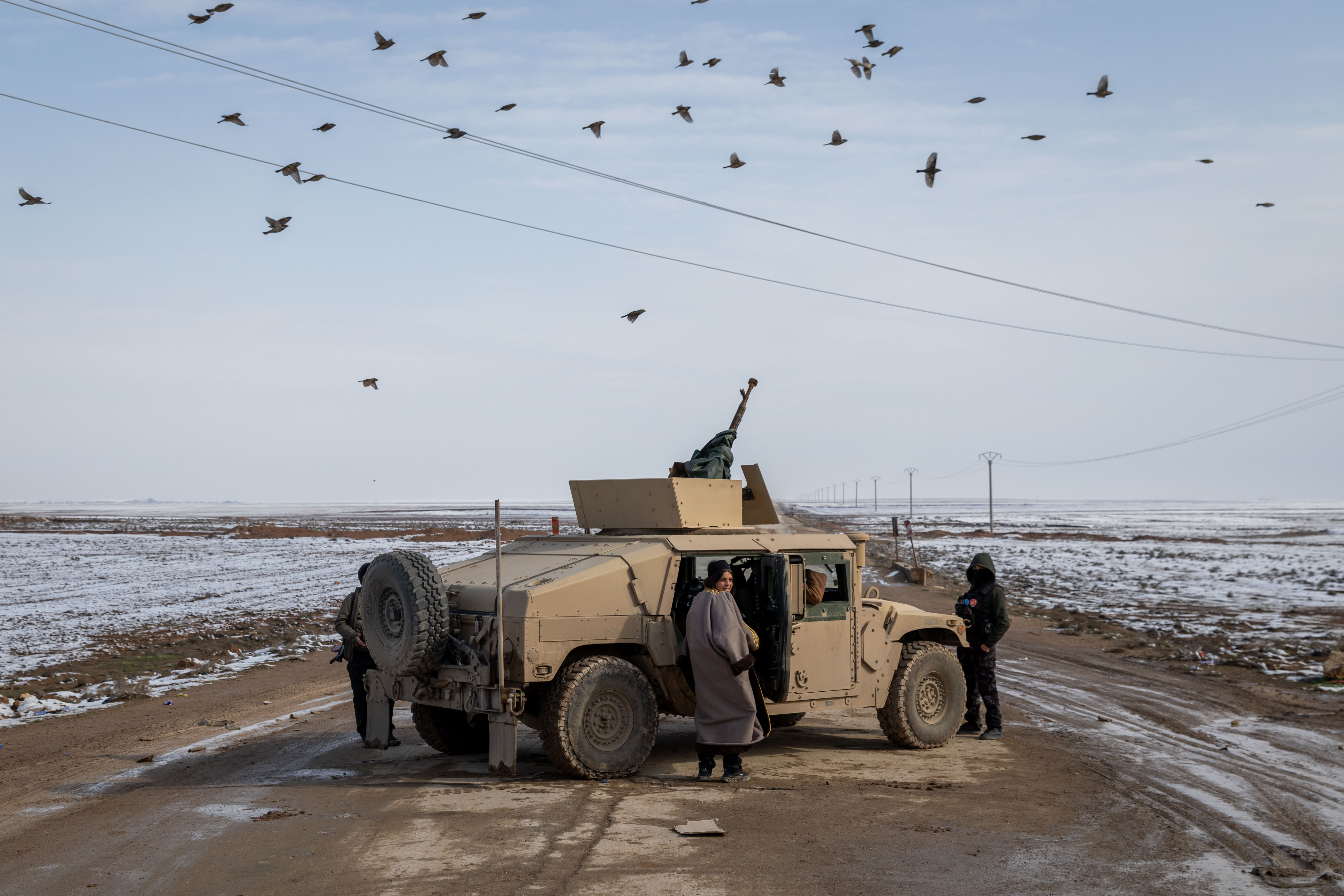 AL HASAKAH, SYRIA - JANUARY 24: YPG fighters operate near a frontline position January 24, 2026 in Al Hasakah, Syria. The fate of Kurdish self-rule in northeast Syria appears increasingly imperilled after weeks of clashes between Syrian government forces and the Kurdish-led SDF, which have forced the SDF to cede large swaths of the region. The United States, which has long backed the Kurdish forces, viewing them as instrumental in the war against ISIS, has shifted its weight behind the new Syrian government, which seeks to integrate the Kurds into the national armed forces. (Photo by Ethan Swope/Getty Images)