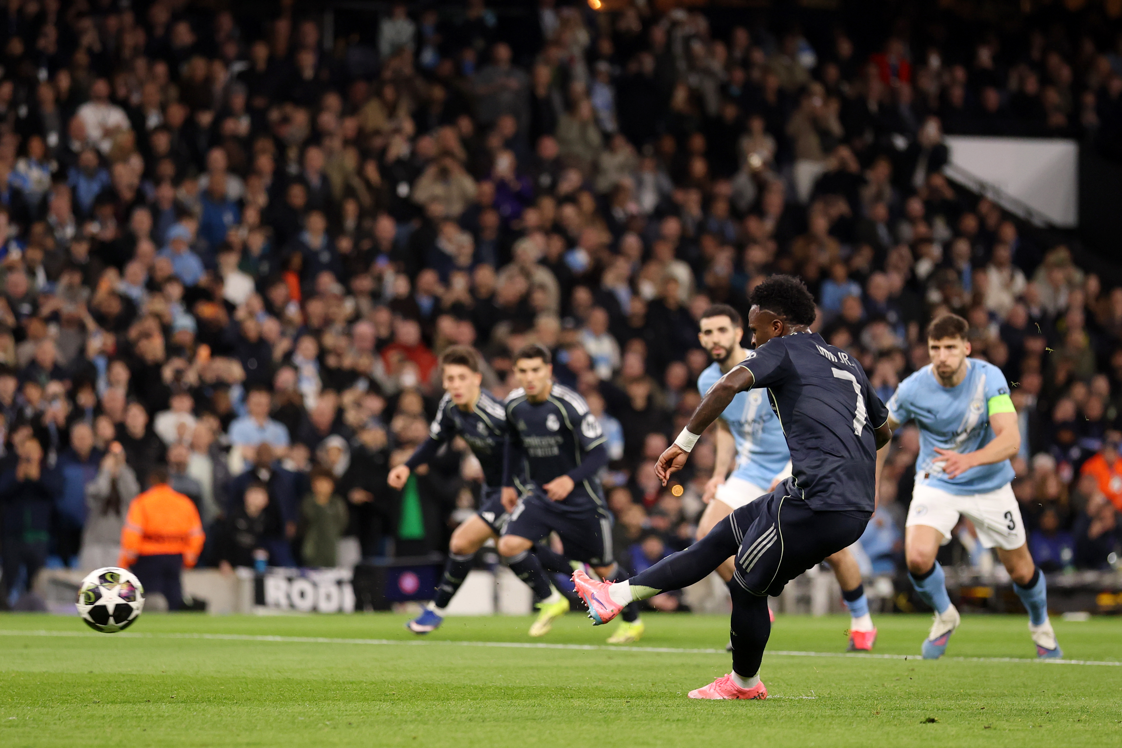 MANCHESTER, ENGLAND - MARCH 17: Vinicius Junior of Real Madrid scores his team's first goal from the penalty spot during the UEFA Champions League 2025/26 Round of 16 Second Leg match between Manchester City FC and Real Madrid CF at City of Manchester Stadium on March 17, 2026 in Manchester, England. (Photo by Carl Recine/Getty Images)