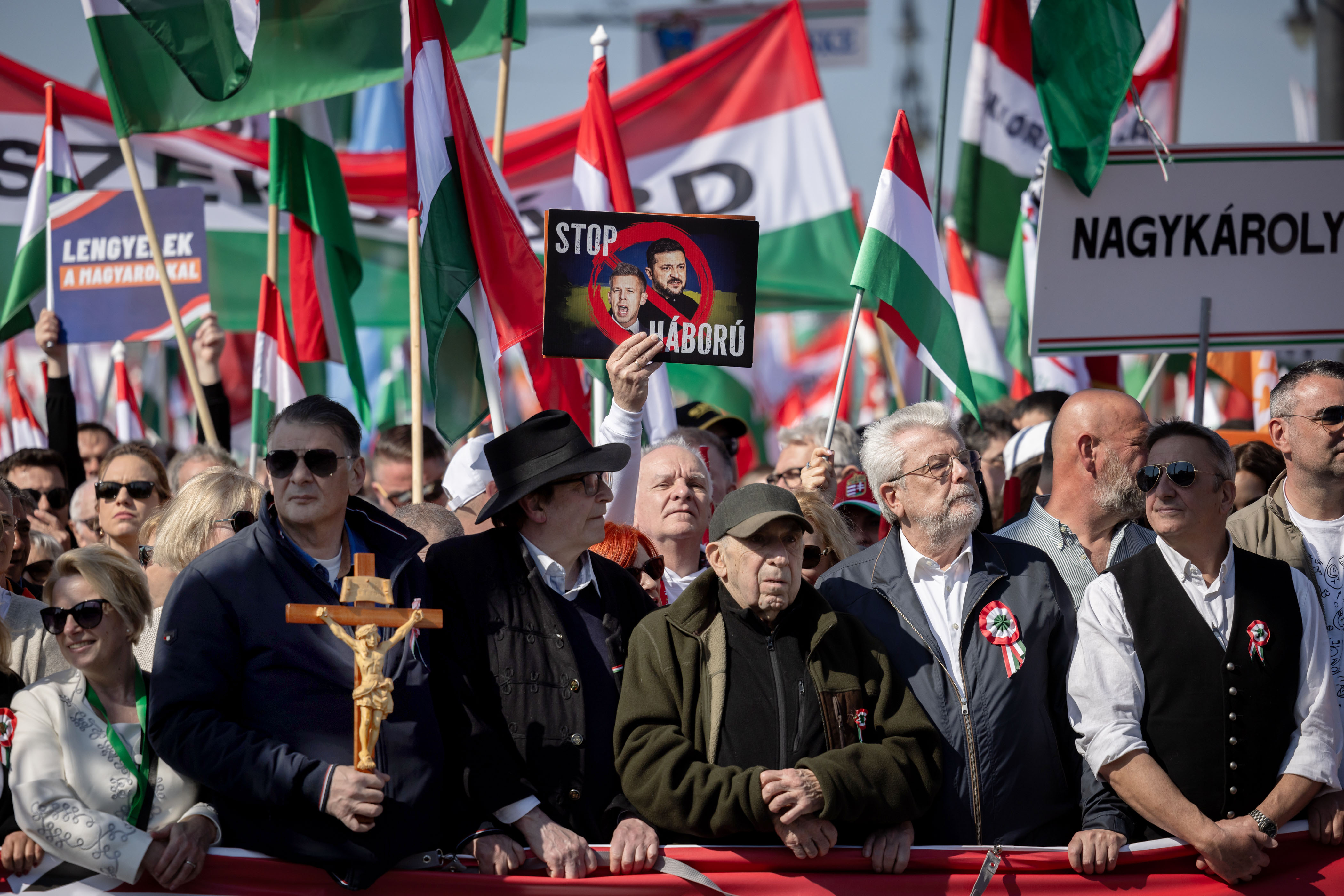 BUDAPEST, HUNGARY - MARCH 15: Supporters of the Fidesz party and Hungarian Prime Minister Viktor Orban, march and hold placards and flags during a demonstration called Peace March on the commemorations of the 178th anniversary of the 1948/49 Hungarian Revolution on March 15, 2026 in Budapest, Hungary. A rally by Fidesz party supporters of Viktor Orban, Hungary's long-serving prime minister, is taking place alongside a demonstration led by Peter Magyar, leader of the Tisza party, and Orban's main challenger in the upcoming parliamentary elections scheduled for April 12. The 1848 Hungarian Revolution sought independence from Austria through a peaceful movement, standing apart from the many European Revolutions of that same year. Despite its failure, it remains pivotal in Hungarian history, with its anniversary, March 15, being one of the nation's three national holidays. (Photo by Janos Kummer/Getty Images)