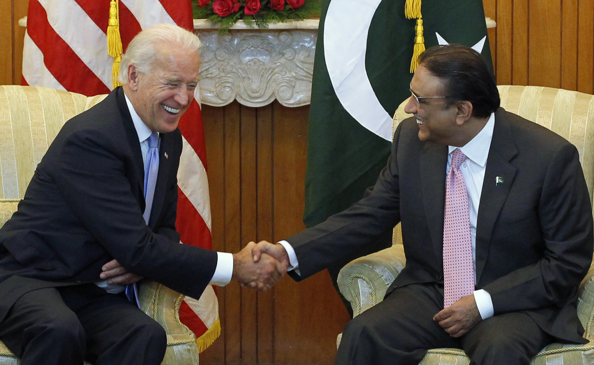 U.S. Vice President Joe Biden (L) shares a laugh while sitting down to meet with Pakistan's President Asif Ali Zardari at the President House in Islamabad January 12, 2011. Biden will pressure Pakistan to intensify its crackdown on militants in talks on Wednesday with Pakistan's leadership, but will tread carefully to avoid further straining ties. REUTERS/Adrees Latif (PAKISTAN - Tags: POLITICS)