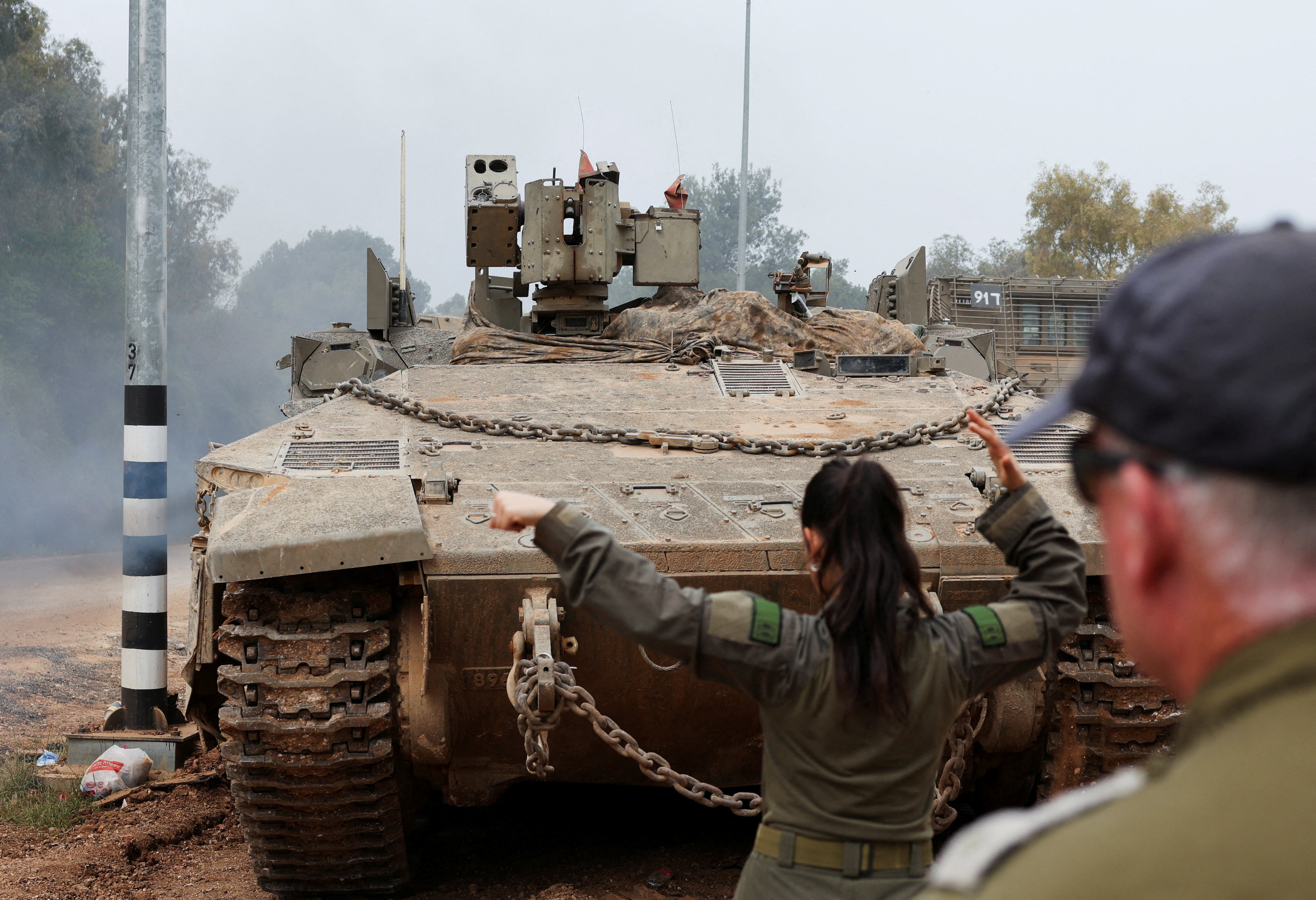 An armoured Israeli military vehicle operates inside Israel, near the Israel-Lebanon border