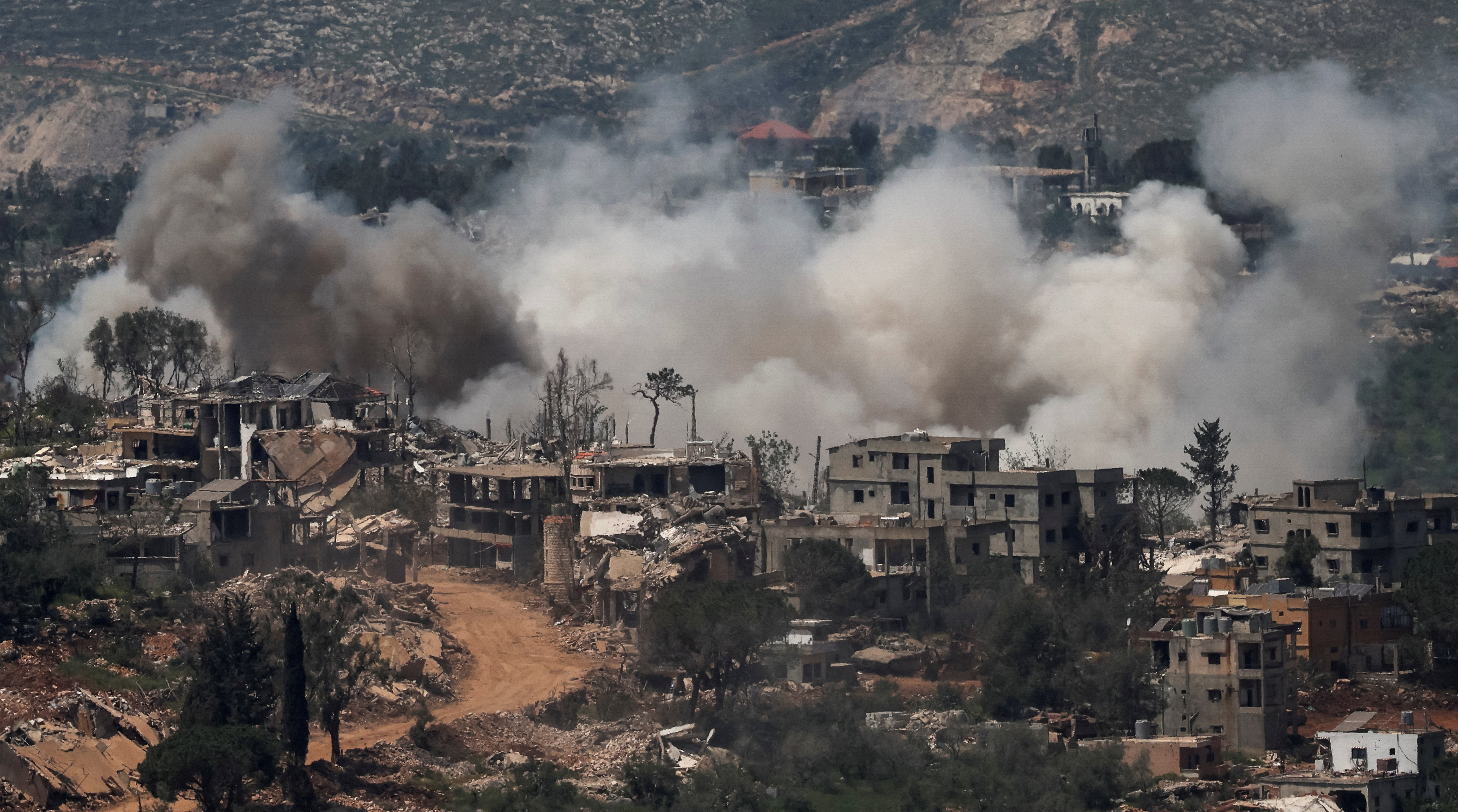 Smoke rises following explosions in southern Lebanon, near the Israel-Lebanon border, as seen from northern Israel, April 27, 2026.