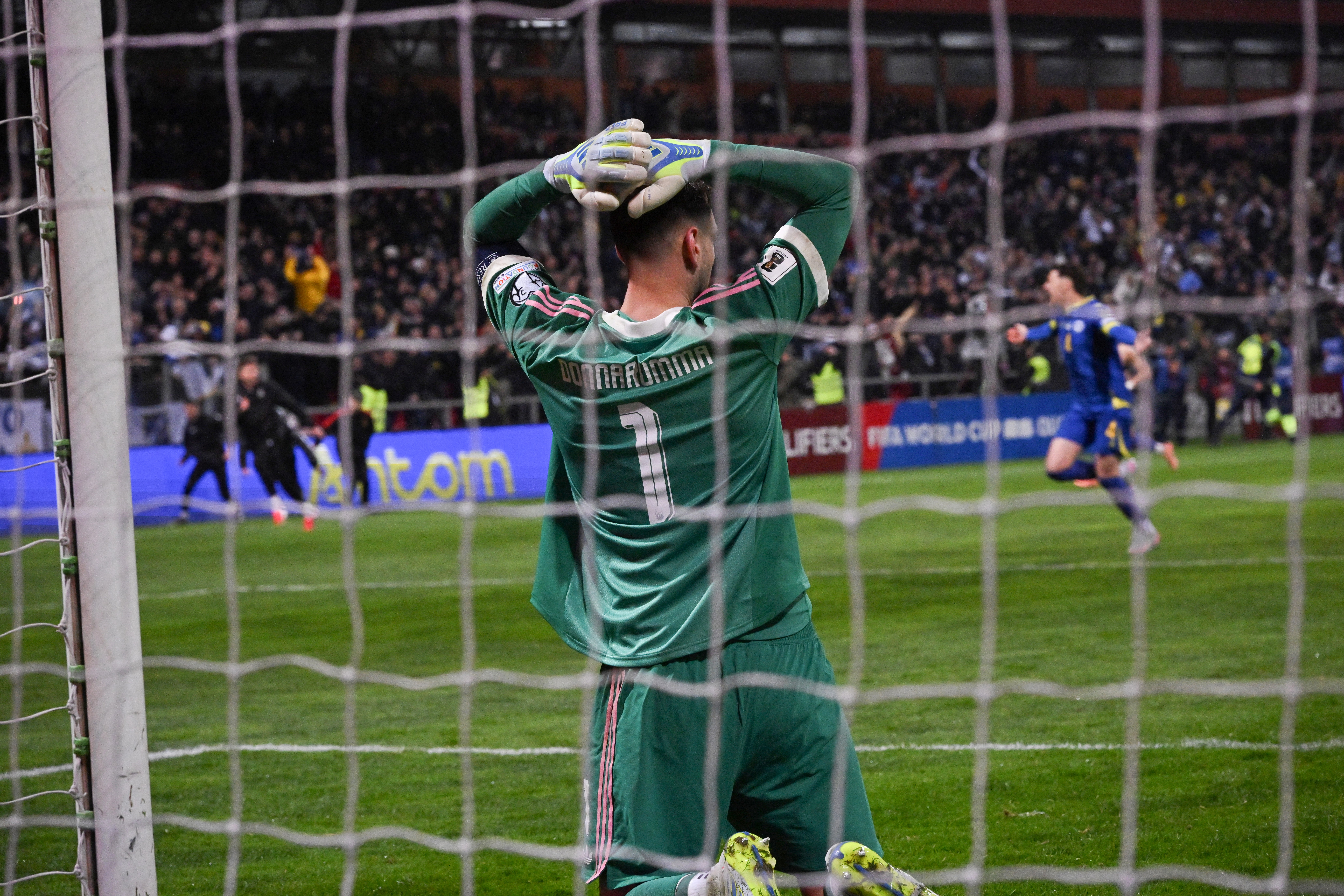 Italy's goalkeeper #01 Gianluigi Donnarumma reacts after being defeated during the FIFA World Cup 2026 European qualification final football match between Bosnia-Herzegovina and Italy at the Bilino-Polje stadium in Zenica on March 31, 2026. (Photo by Elvis BARUKCIC / AFP)