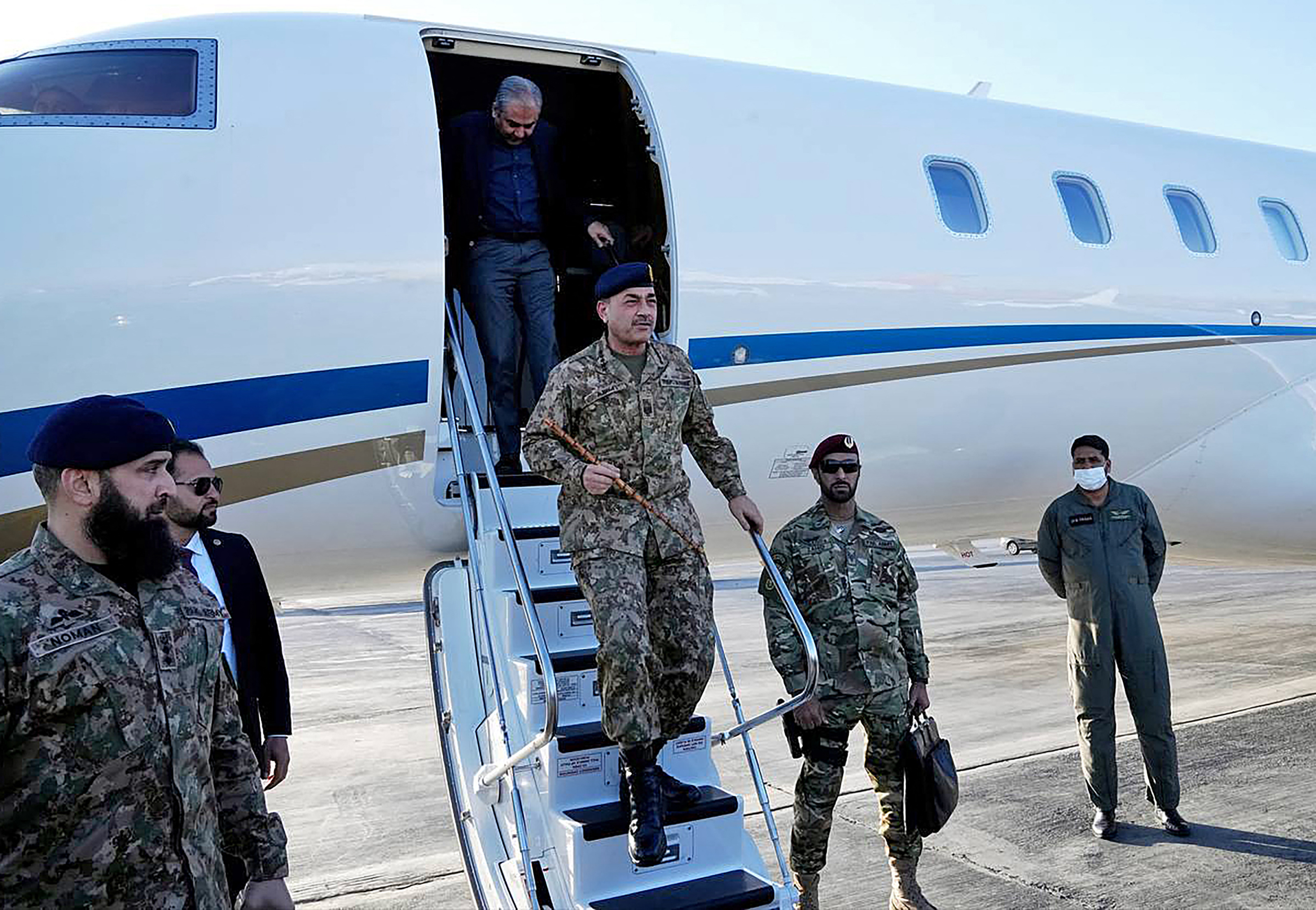 This handout photo taken and provided by the Iranian Foreign Ministry on April 15, 2026 shows Pakistan's Army Chief Asim Munir disembarking from an aircraft upon his arrival at the airport in Tehran. Iranian Foreign Minister Abbas Araghchi welcomed on April 15 a Pakistani delegation led by army chief Munir, days after failed US-Iran talks in Islamabad to end the Middle East war. (Photo by Iranian Foreign Ministry / AFP) / RESTRICTED TO EDITORIAL USE - MANDATORY CREDIT "AFP PHOTO / Iranian Foreign Ministry" - HANDOUT - NO MARKETING NO ADVERTISING CAMPAIGNS - DISTRIBUTED AS A SERVICE TO CLIENTS