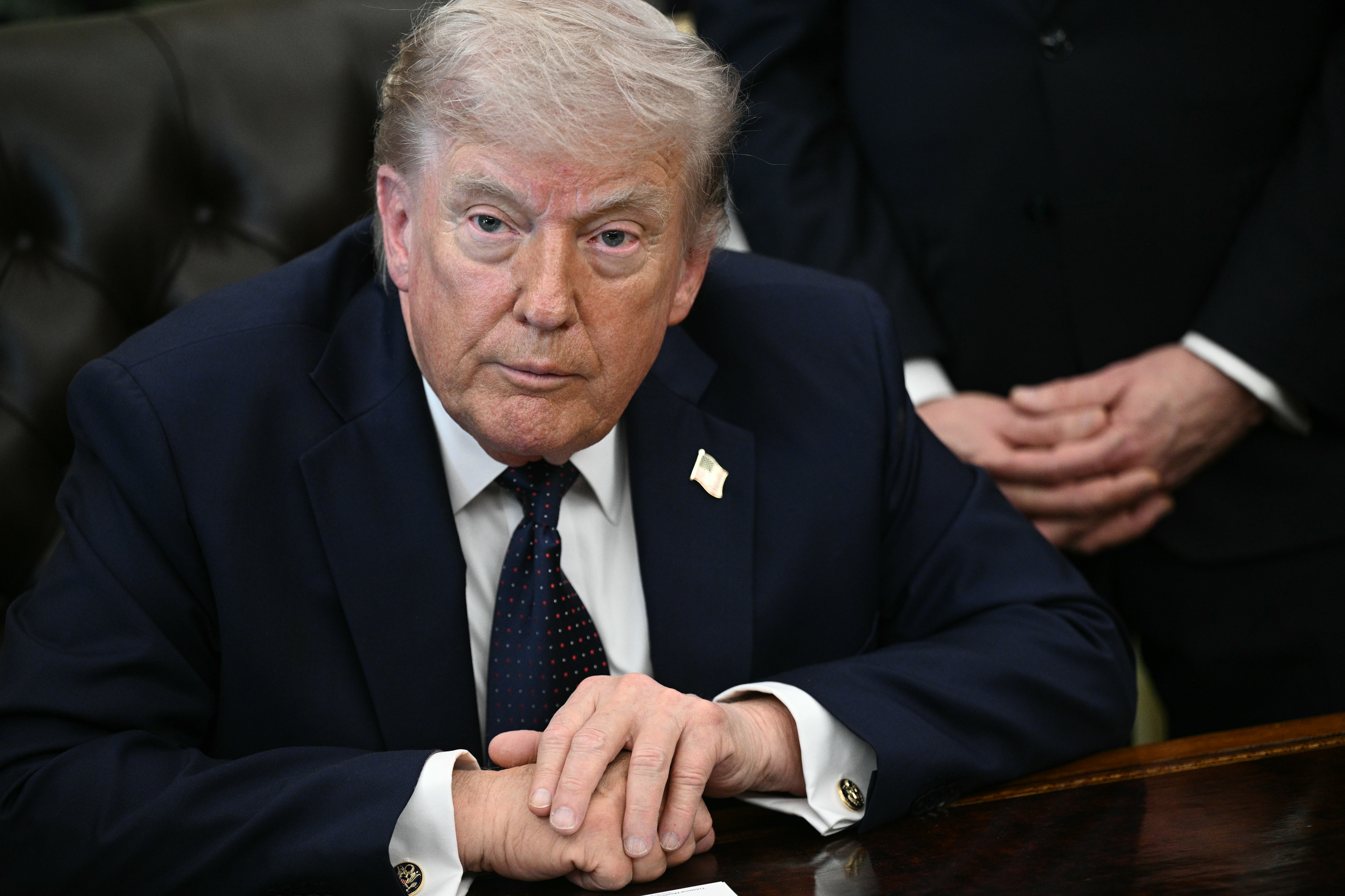 US President Donald Trump looks on during a meeting with Lebanon's Ambassador to the US, Nada Hamadeh Moawad, and Israel's Ambassador to the US, Yechiel Leiter, at the White House in Washington, DC on April 23, 2026. US President Donald Trump met Lebanese and Israeli envoys at a new round of peace talks Thursday, with Beirut seeking a one-month extension of a shaky ceasefire set to expire. (Photo by Brendan SMIALOWSKI / AFP)