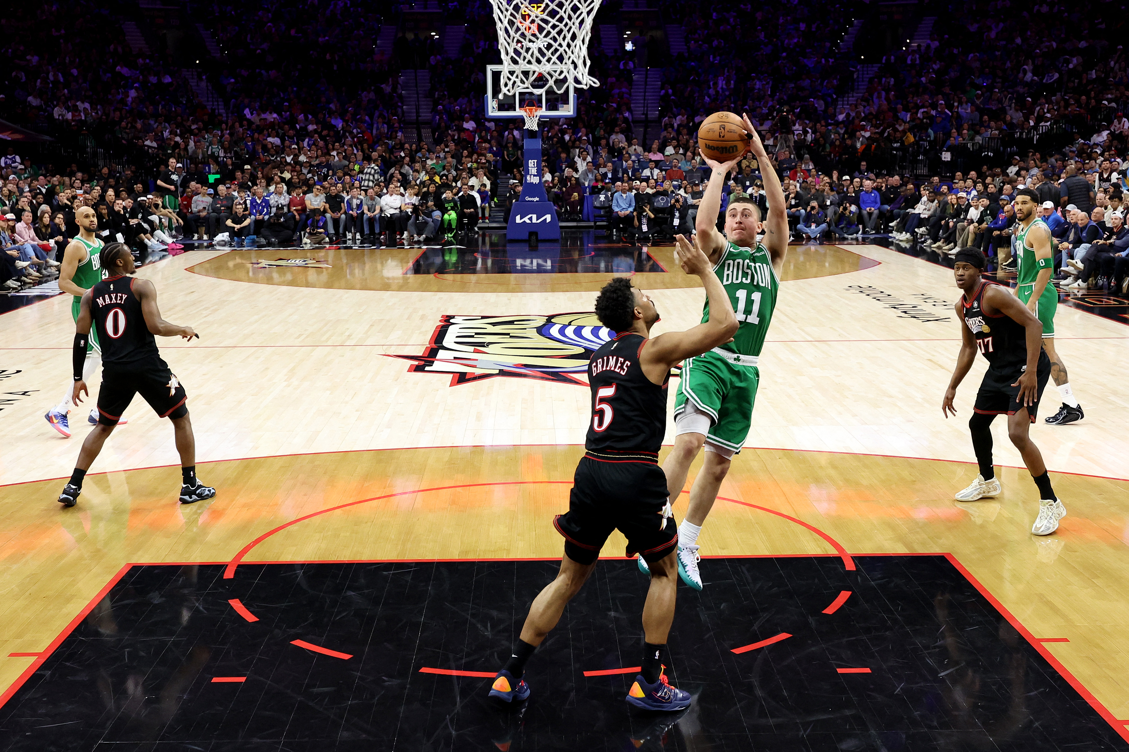 PHILADELPHIA, PENNSYLVANIA - APRIL 26: Payton Pritchard #11 of the Boston Celtics shoots against Quentin Grimes #5 of the Philadelphia 76ers during the second half of game four of the Eastern Conference first round playoffs at Xfinity Mobile Arena on April 26, 2026 in Philadelphia, Pennsylvania. NOTE TO USER: User expressly acknowledges and agrees that, by downloading and or using this photograph, User is consenting to the terms and conditions of the Getty Images License Agreement. Emilee Chinn/Getty Images/AFP (Photo by Emilee Chinn / GETTY IMAGES NORTH AMERICA / Getty Images via AFP)
