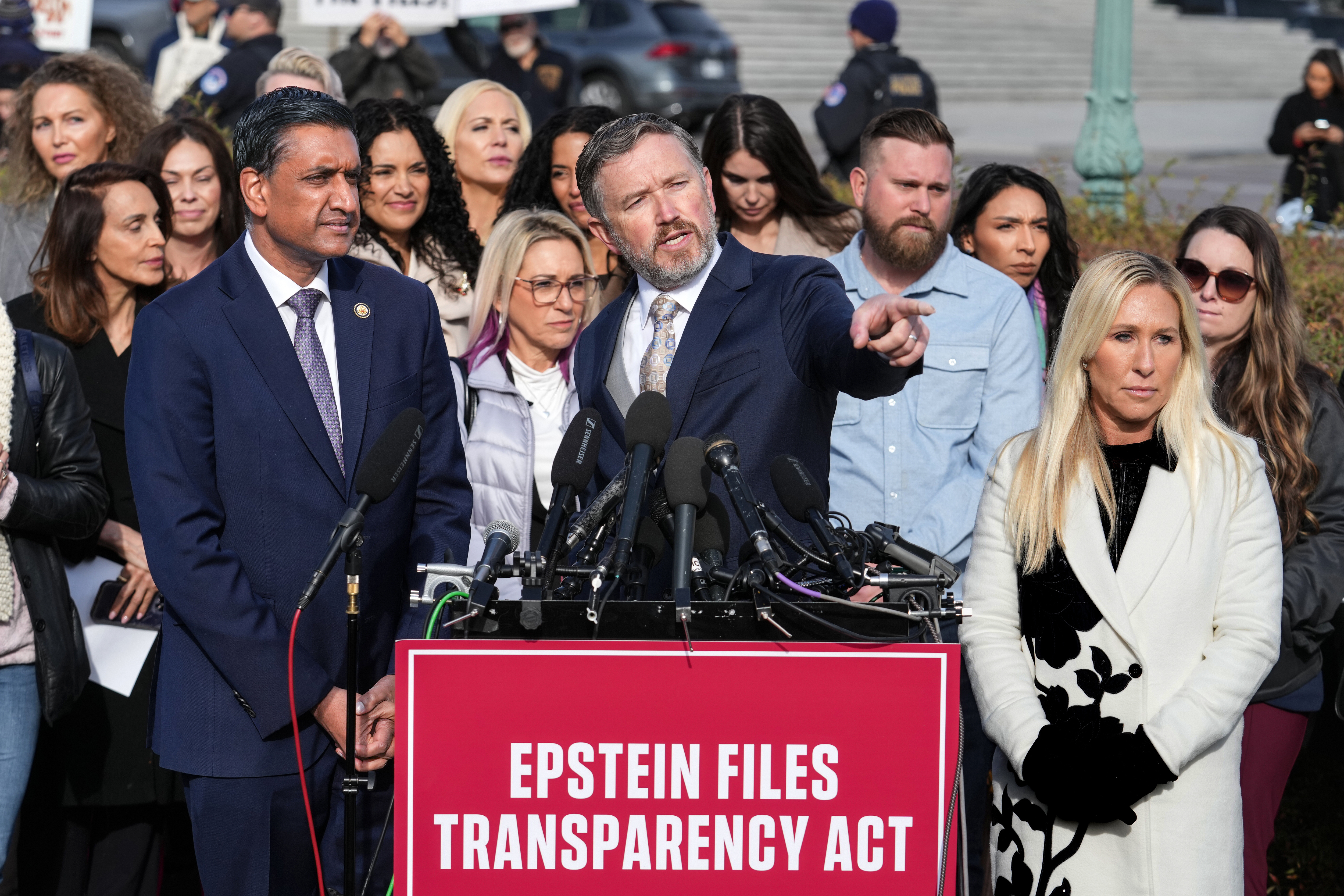 Rep. Ro Khanna, D-Calif., from left, Rep. Thomas Massie, R-Ky., and Rep. Marjorie Taylor-Greene, R-Ga., speak during a news conference as the House prepares to vote on the Epstein Files Transparency Act, at the Capitol in Washington, Tuesday, Nov. 18, 2025, as they are joined by survivors and family members who recounted their personal stories of Epstein. (AP Photo/J. Scott Applewhite)