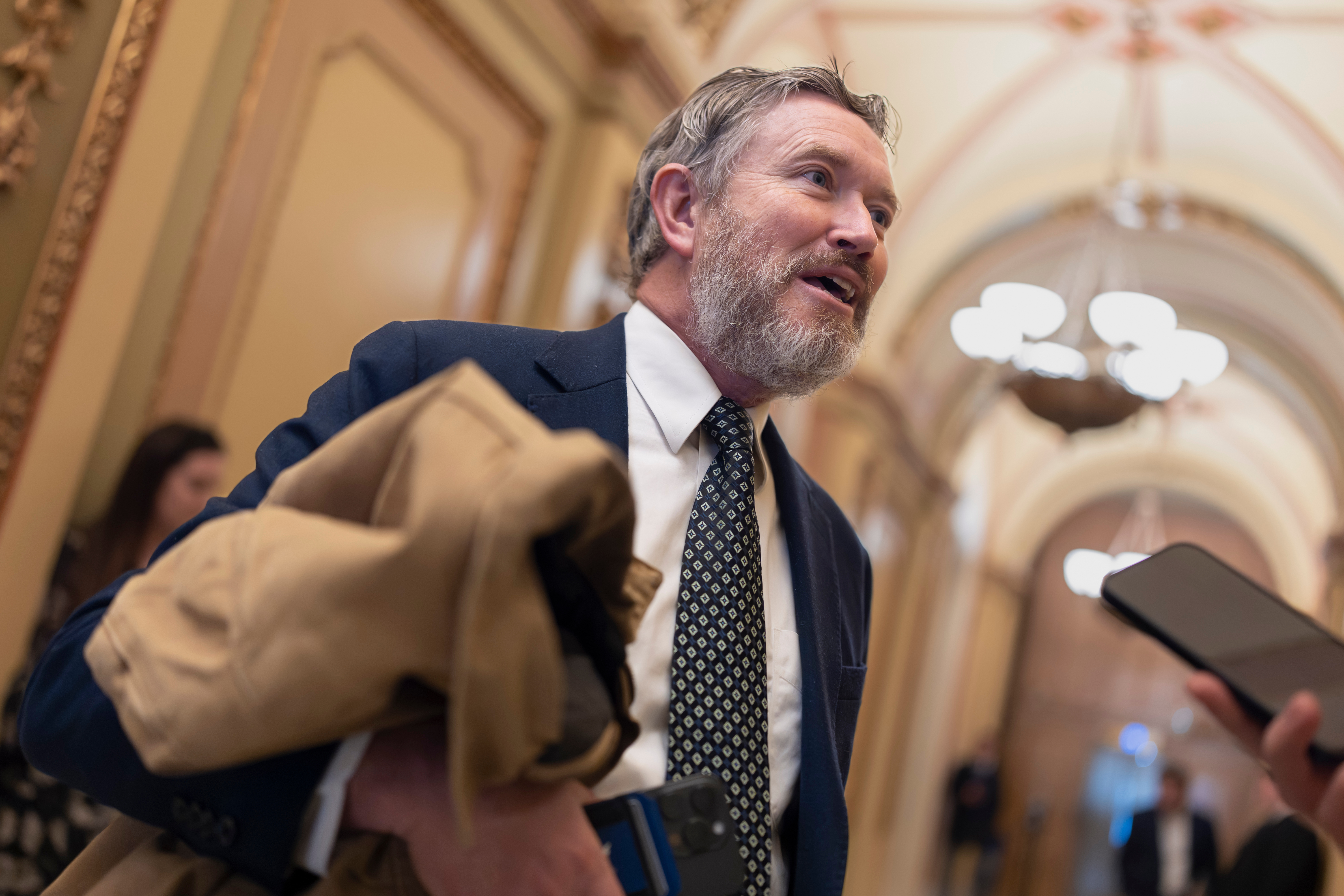 Rep. Thomas Massie, R-Ky., speaks outside the House chamber before the final votes of the week, at the Capitol in Washington, Friday, Dec. 12, 2025. (AP Photo/J. Scott Applewhite)