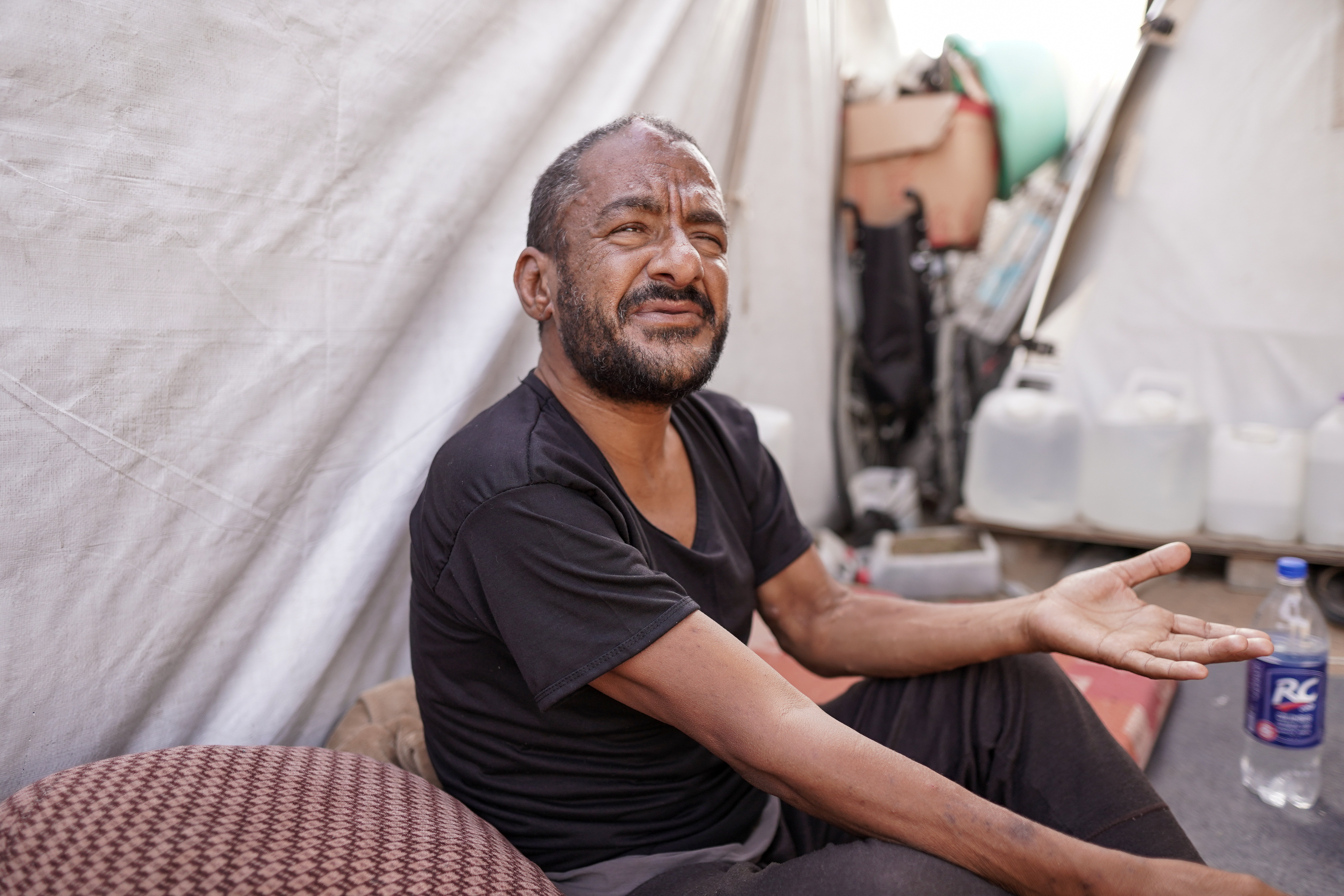 Man sat in a tent