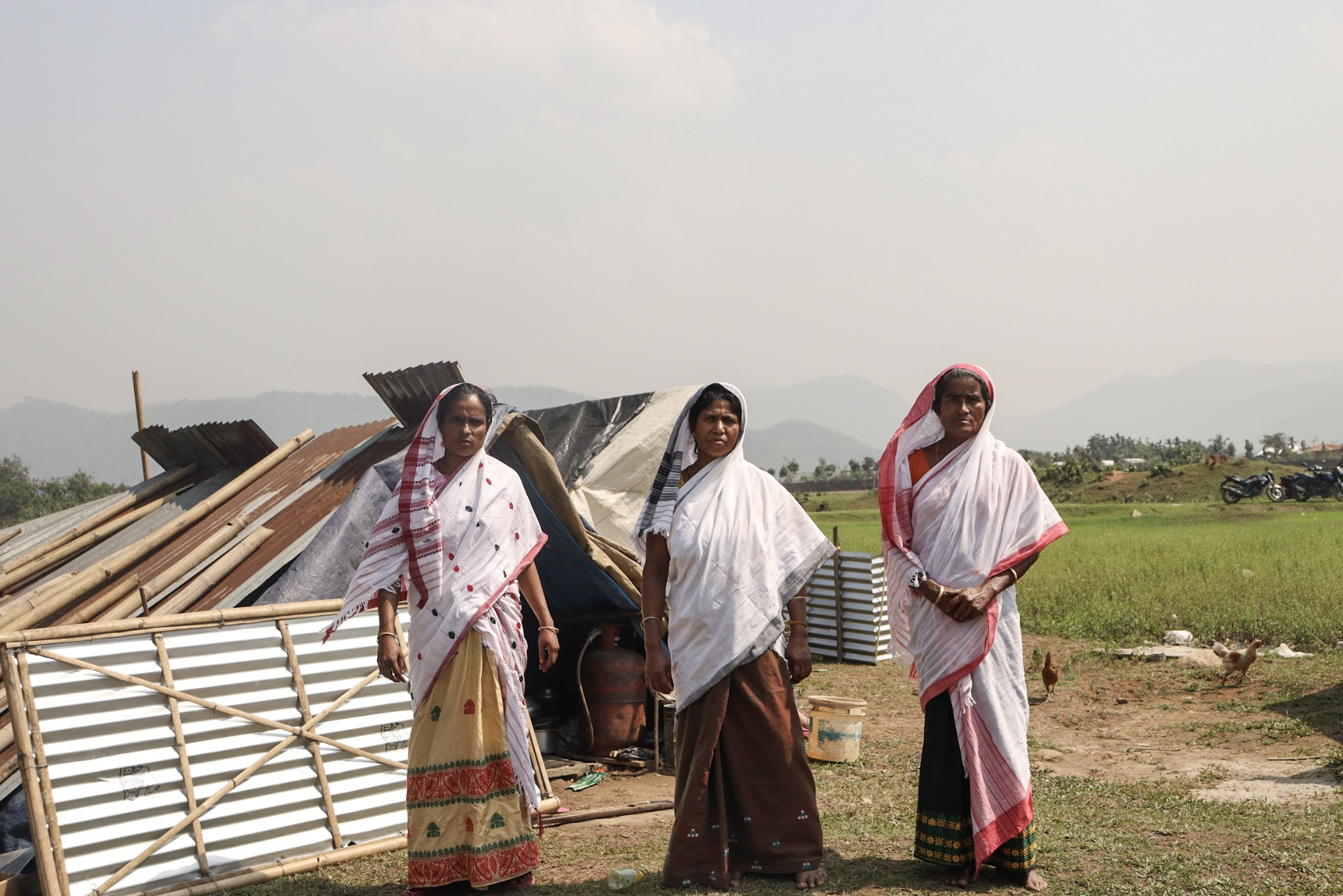 Three indigenous Muslims among the 4 million clad in Assamese traditional attire.