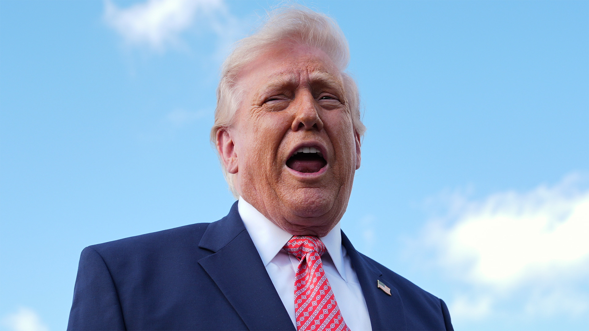 President Donald Trump speaks to reporters after stepping off Air Force One, Friday, March 27, 2026, at Miami International Airport in Miami.
