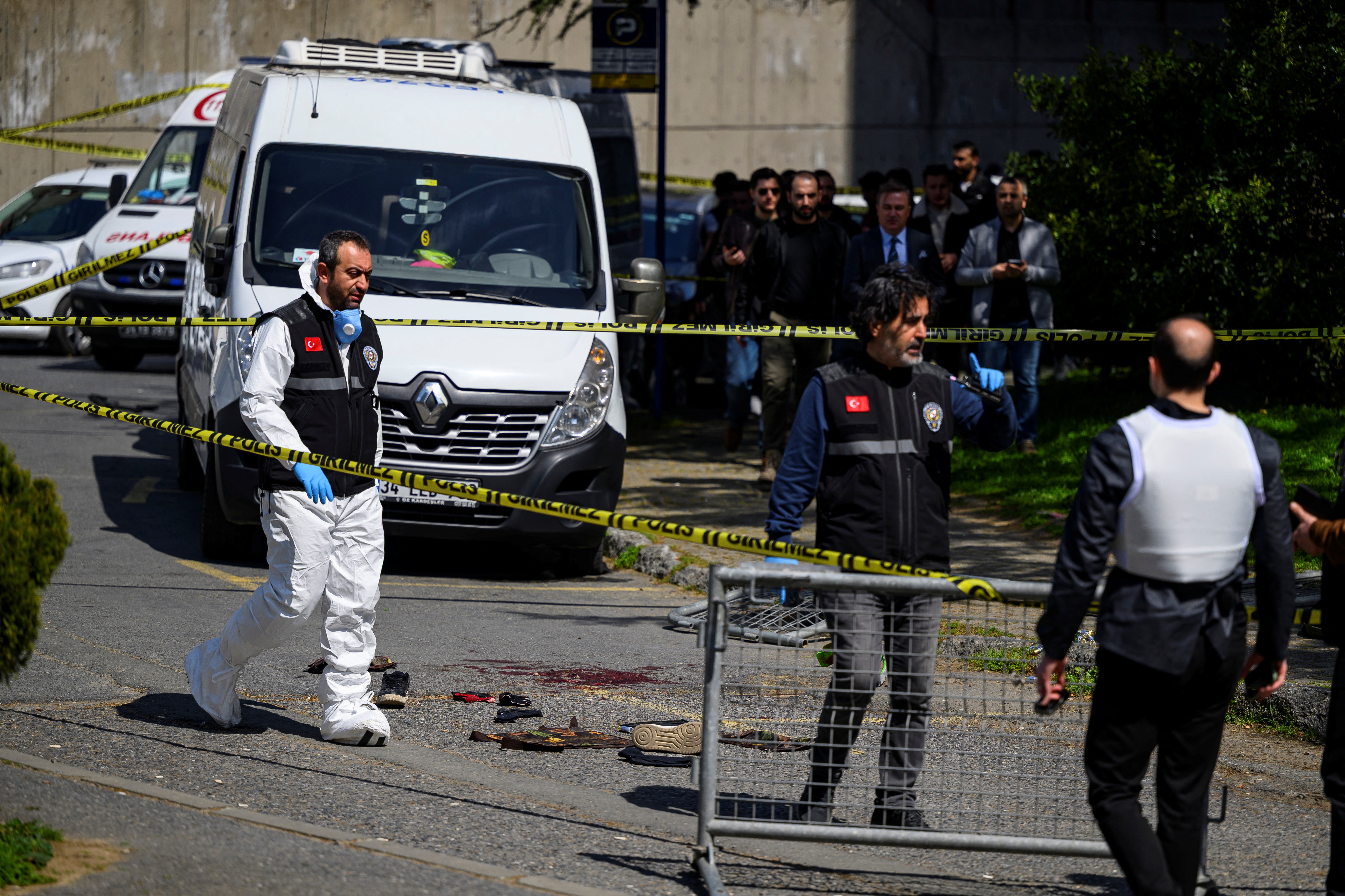 TOPSHOT - Police officials gather outside The Israeli Consulate in Istanbul on April 7, 2026, following a shootout between gunmen and police.
