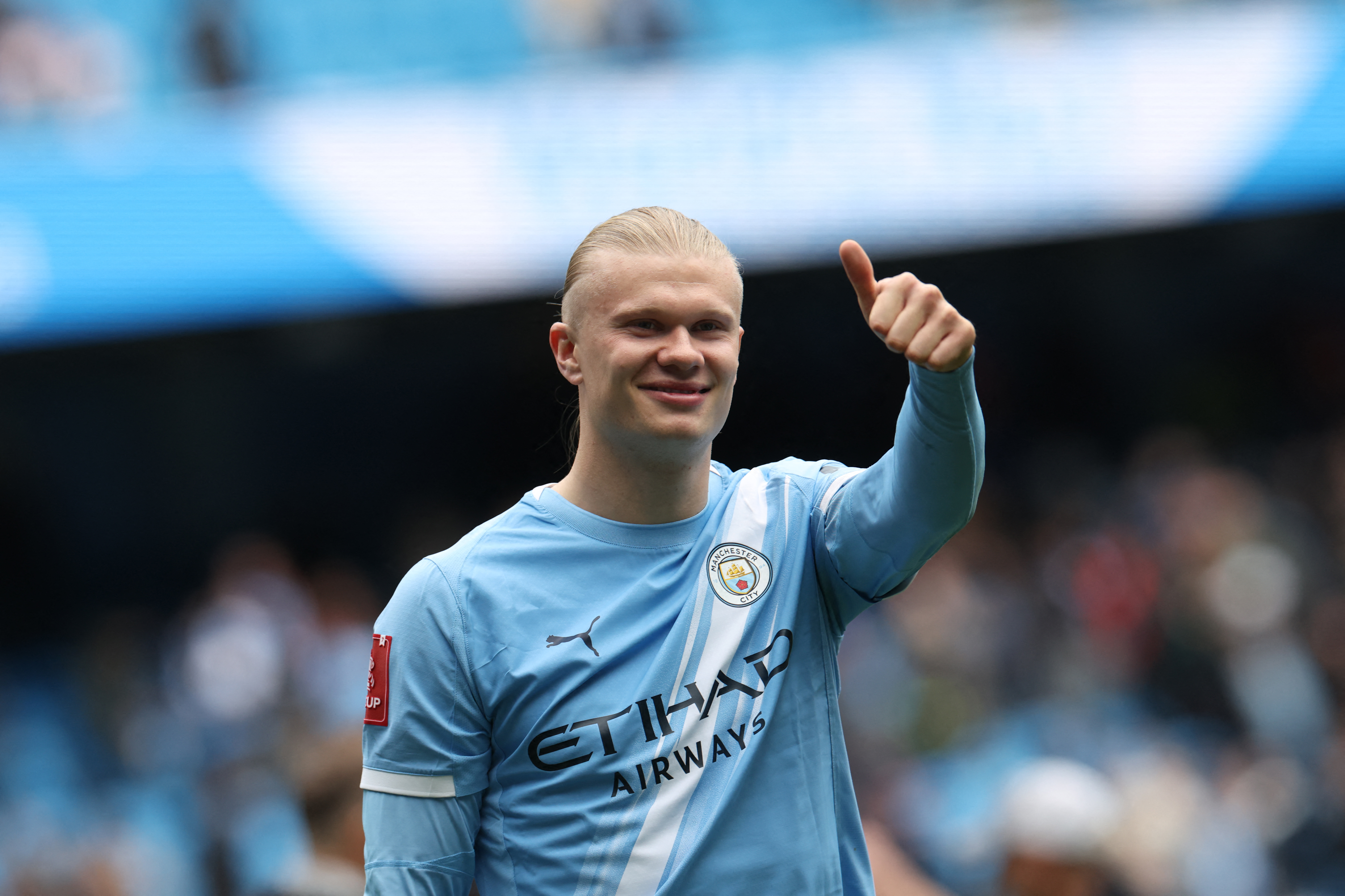 Manchester City's Norwegian striker #09 Erling Haaland celebrates on the pitch after scoring a hat-trick, after the English FA Cup quarter final football match between Manchester City and Liverpool at the Etihad Stadium in Manchester, north west England, on April 4, 2026.