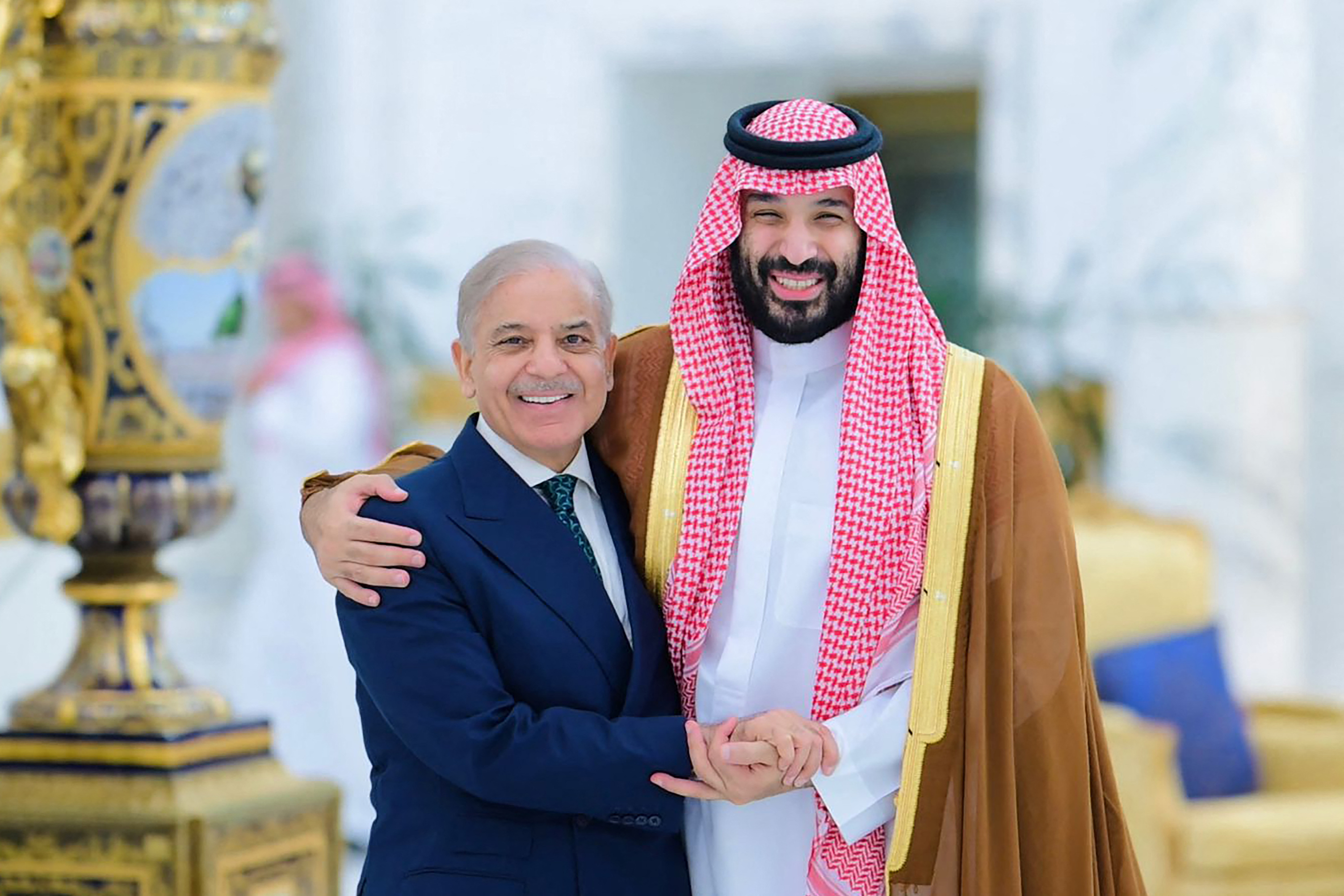 This handout photograph taken and released by Pakistan's Prime Minister Office on April 15, 2026 shows Saudi Arabia's Crown Prince Mohammed bin Salman (R) greeting Pakistan's Prime Minister Shehbaz Sharif prior to their meeting in Jeddah.
