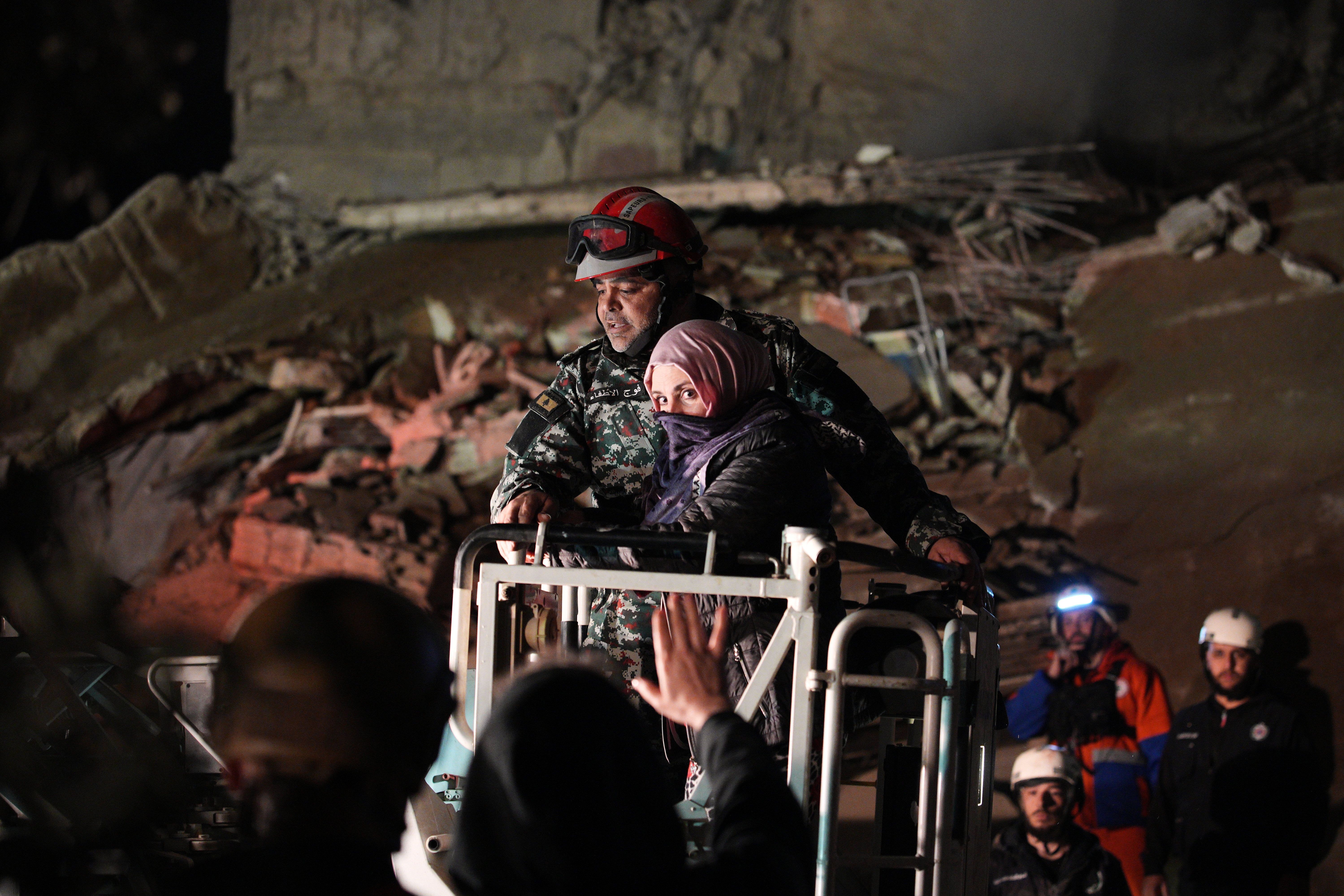 A woman who survived an Israeli airstrike is rescued by a firefighter from a destroyed building in central Beirut, Lebanon, Wednesday, April 8, 2026. (AP Photo/Emilio Morenatti)