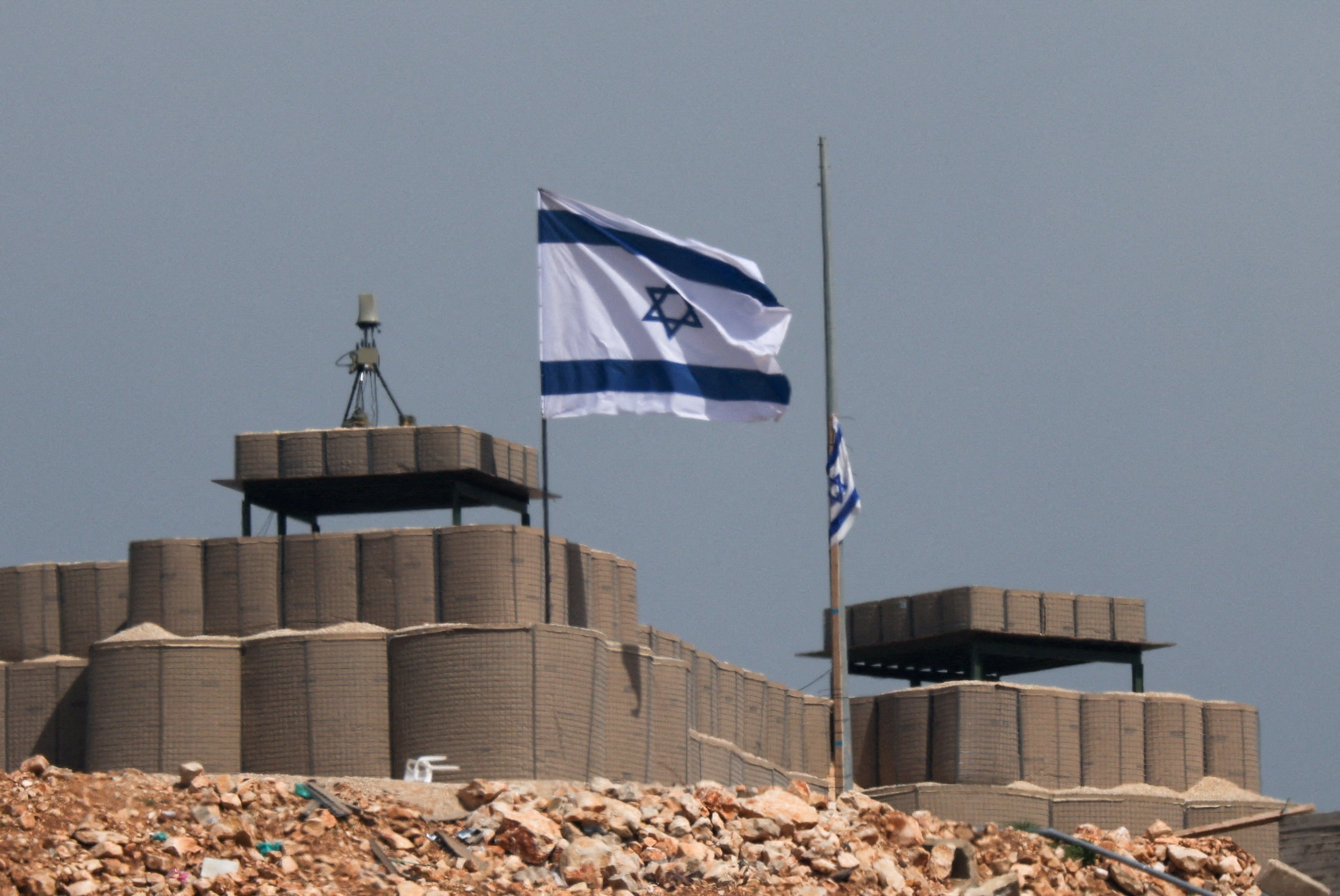 An Israeli flag flutters at a military base in Lebanon, near the Israel-Lebanon border.