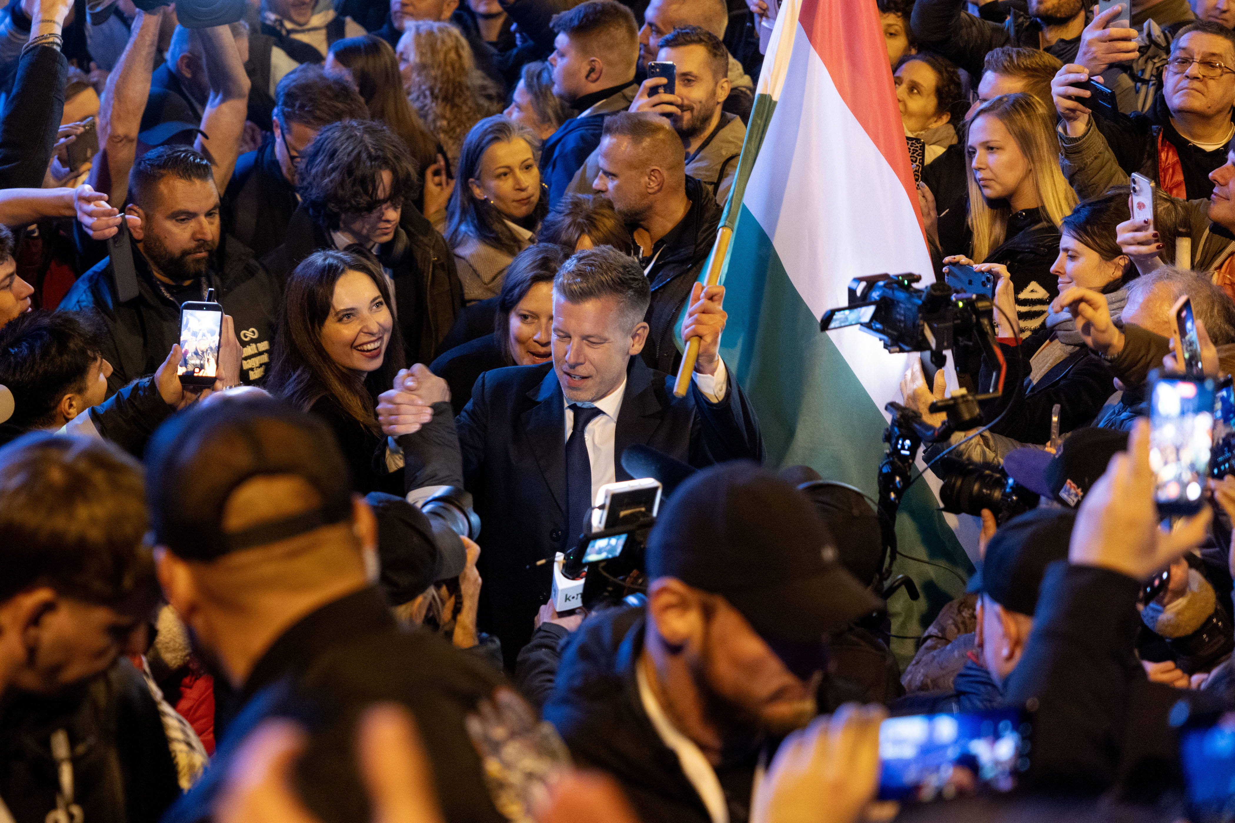 BUDAPEST, HUNGARY - APRIL 12: Peter Magyar, lead candidate of the Tisza party, greets his supporters after the Tisza party won the parliamentary elections on April 12, 2026 in Budapest, Hungary. Magyar, who has gone into the election with a substantial lead in polls, is seeking to unseat Prime Minister Viktor Orban. (Photo by Janos Kummer/Getty Images)