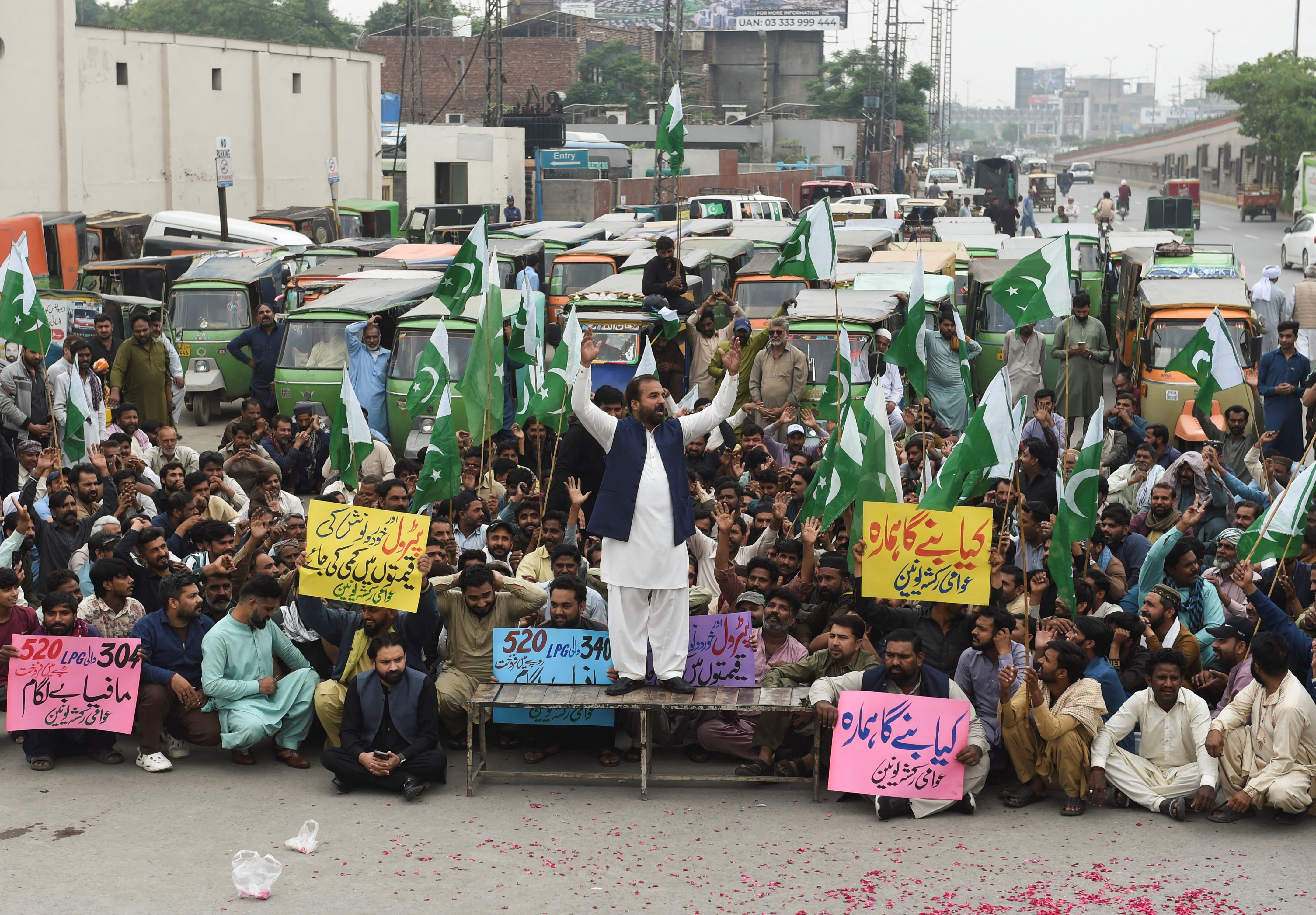 Auto rickshaw drivers, along with members of the Awami Rickshaw Union, take part in a protest against the rising fuel prices, amid the U.S.-Israeli conflict with Iran, in Lahore, Pakistan, April 7, 2026. REUTERS/Murtaza Ali