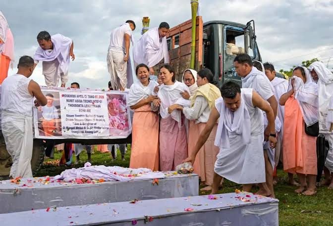 Family members mourn during the funeral of an infant and a five-year-old killed in Tronglaobi, Manipur in April 2026 [Tanushree Pandey/ Al Jazeera]