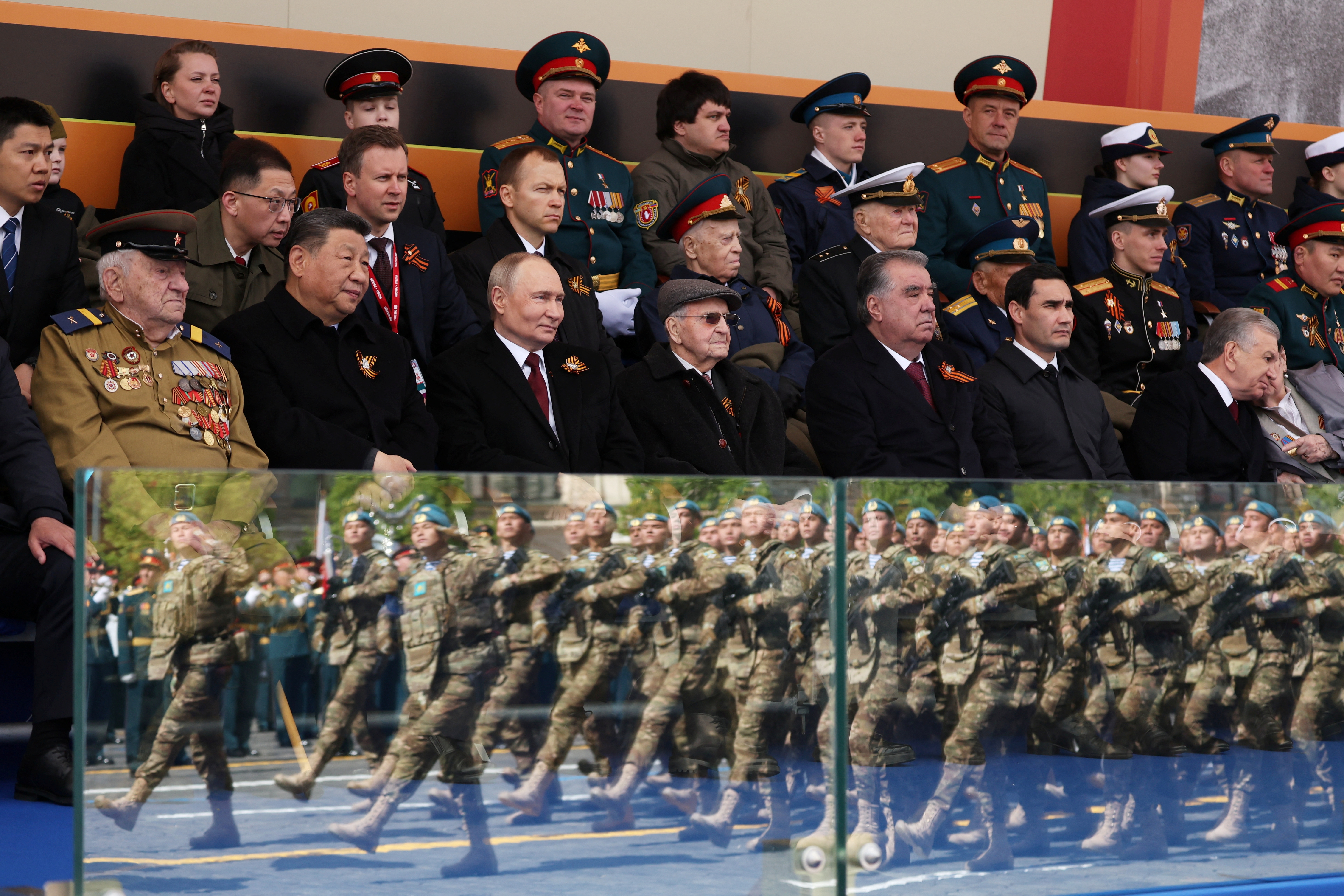 Spectators, including Russian President Vladimir Putin, Chinese President Xi Jinping, Tajik President Emomali Rahmon, Turkmen President Serdar Berdimuhamedov and Uzbek President Shavkat Mirziyoyev, attend a military parade on Victory Day, marking the 80th anniversary of the victory over Nazi Germany in World War Two, in Red Square in central Moscow, Russia, May 9, 2025. Sputnik/Vyacheslav Prokofyev/Pool via REUTERS ATTENTION EDITORS - THIS IMAGE WAS PROVIDED BY A THIRD PARTY.