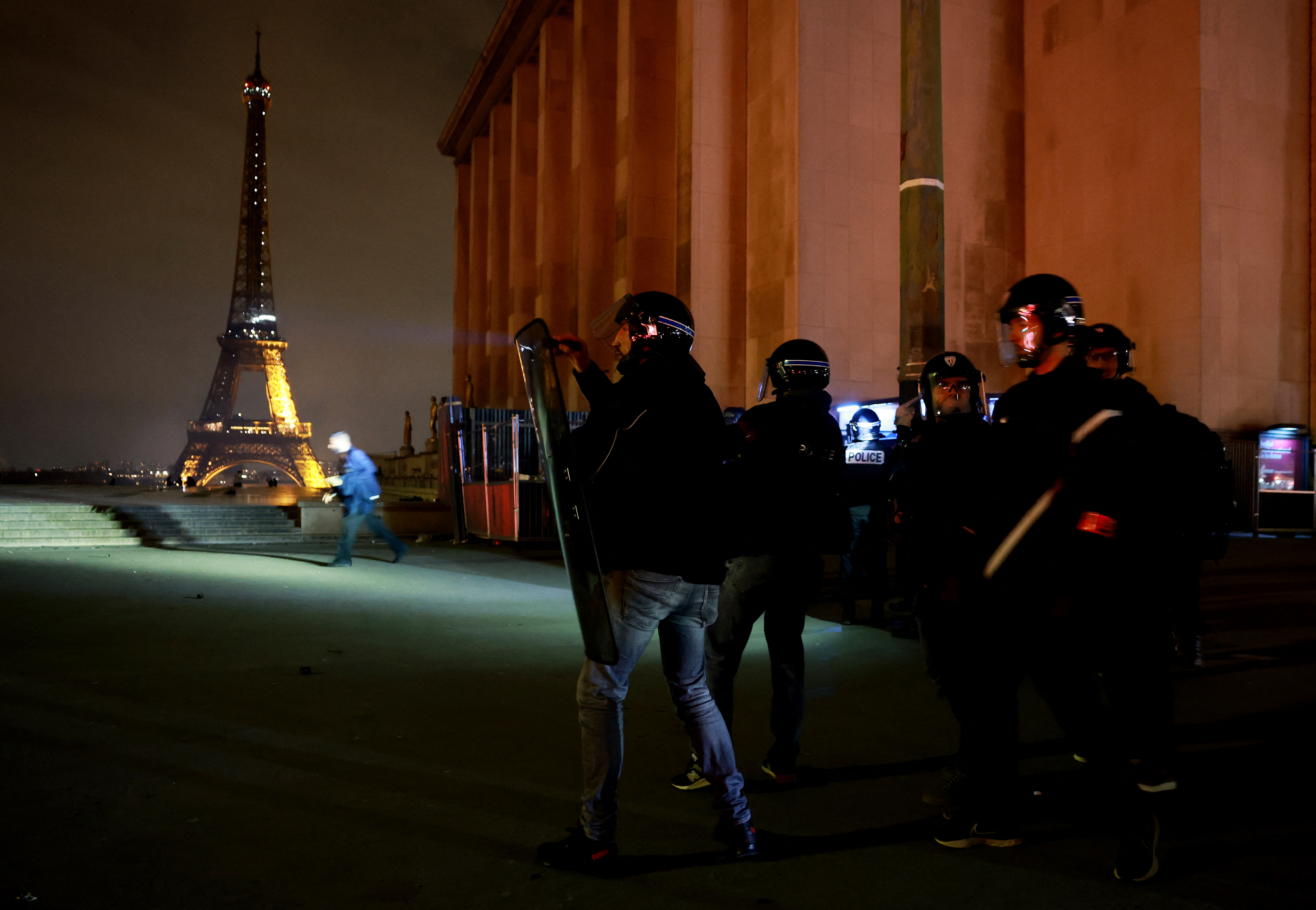 Riot police near the Eiffel Tower after Paris St Germain won the semi final match against Bayern Munich 