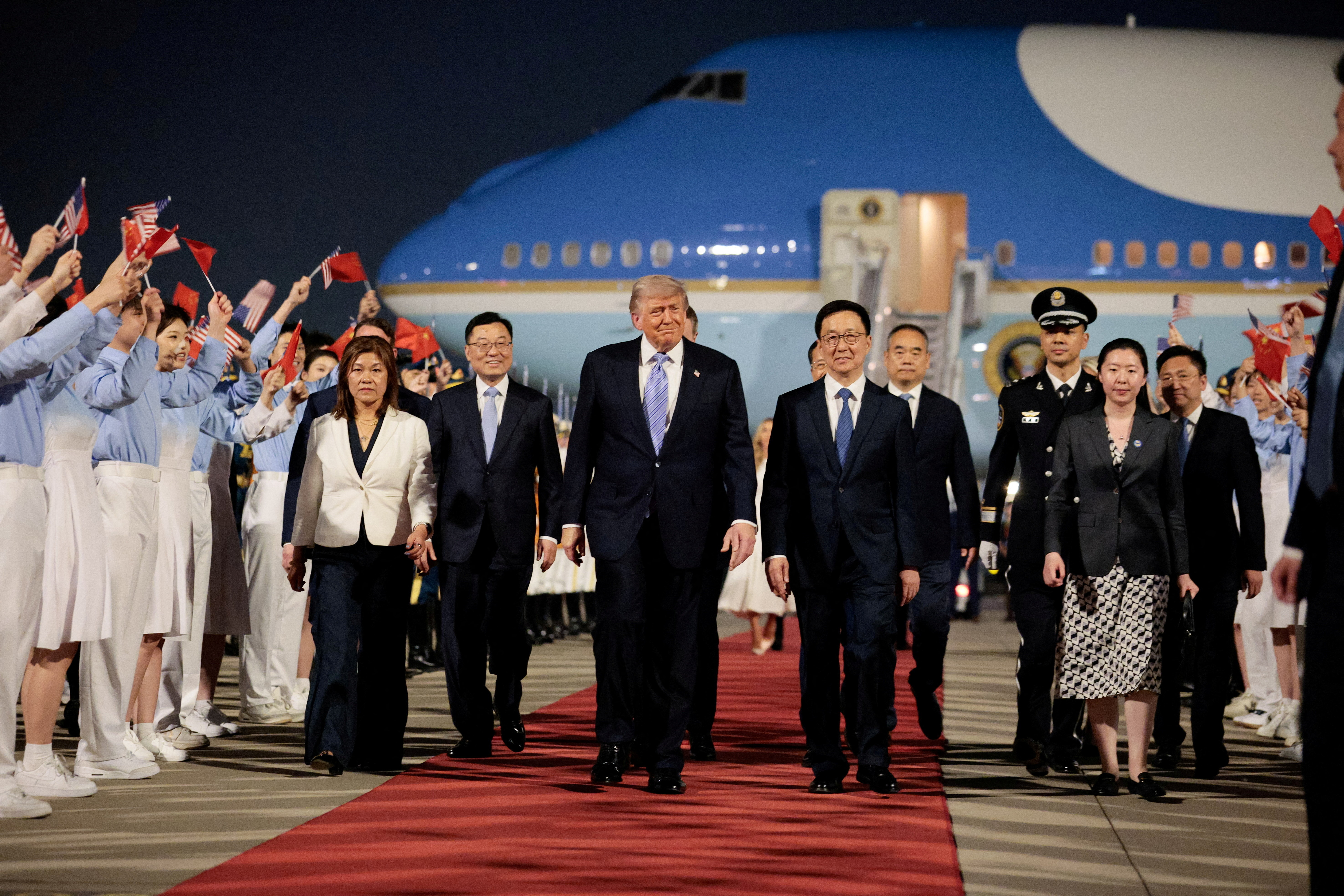 U.S. President Donald Trump walks with Chinese Vice President Han Zheng during an arrival ceremony at Beijing Capital International Airport, in Beijing, China, May 13, 2026.