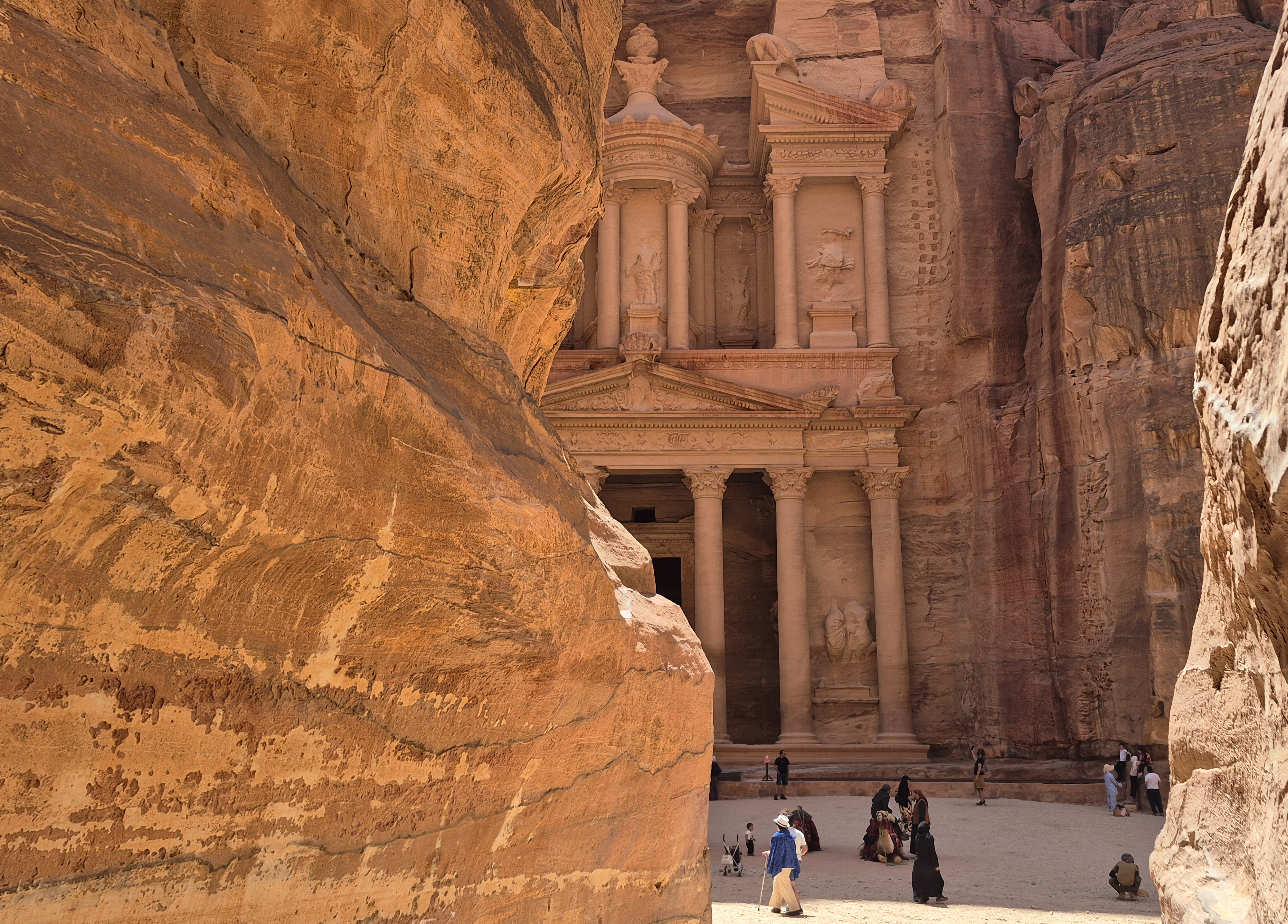Tourists visit the Treasury in the ruins of the ancient Nabatean city of Petra