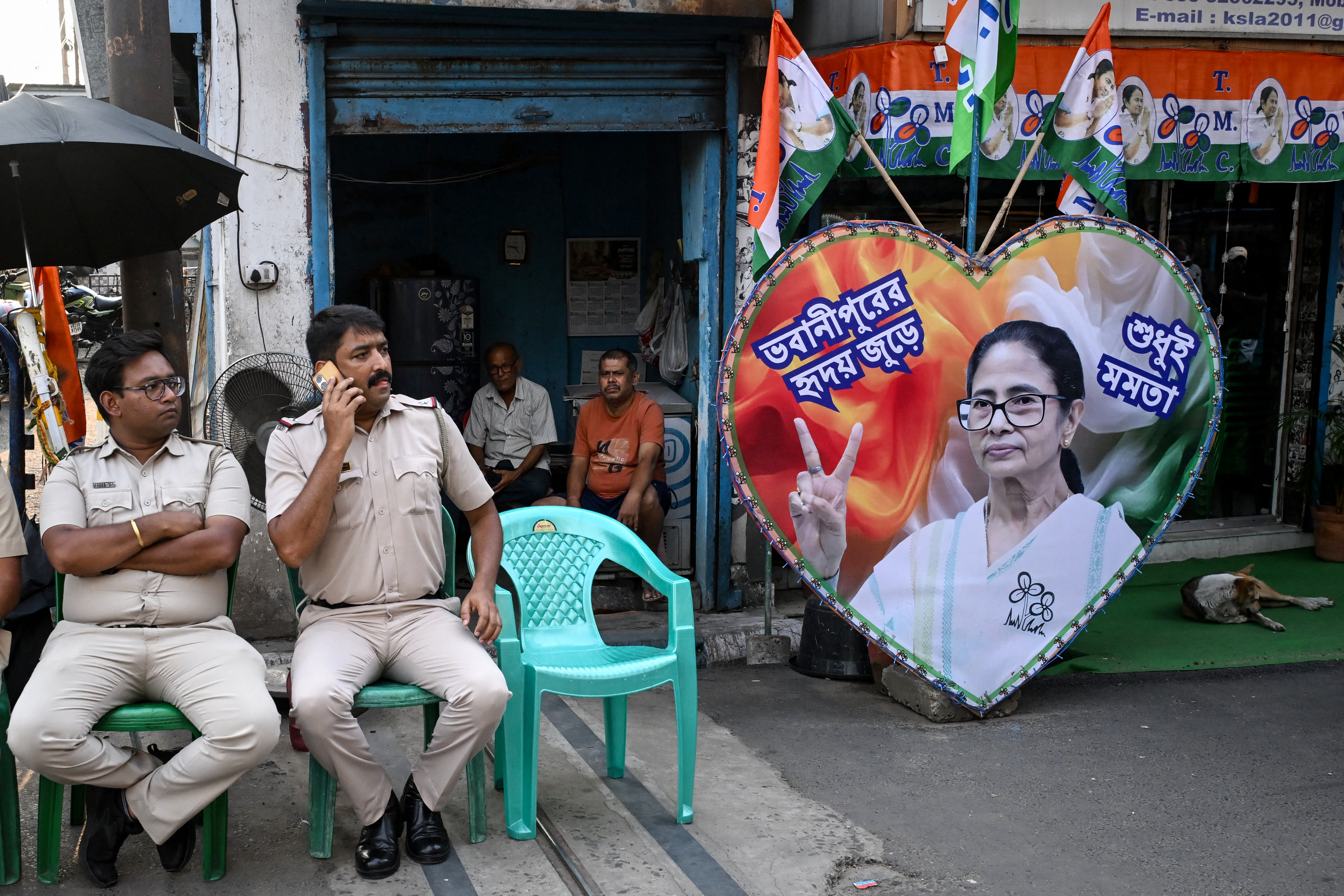 TOPSHOT - Police personnel guard the road leading towards the residence of West Bengal Chief Minister and All India Trinamool Congress (TMC) party chairperson Mamata Banerjee in Kolkata on May 5, 2026 after her party lost the recently concluded state legislative assembly elections.