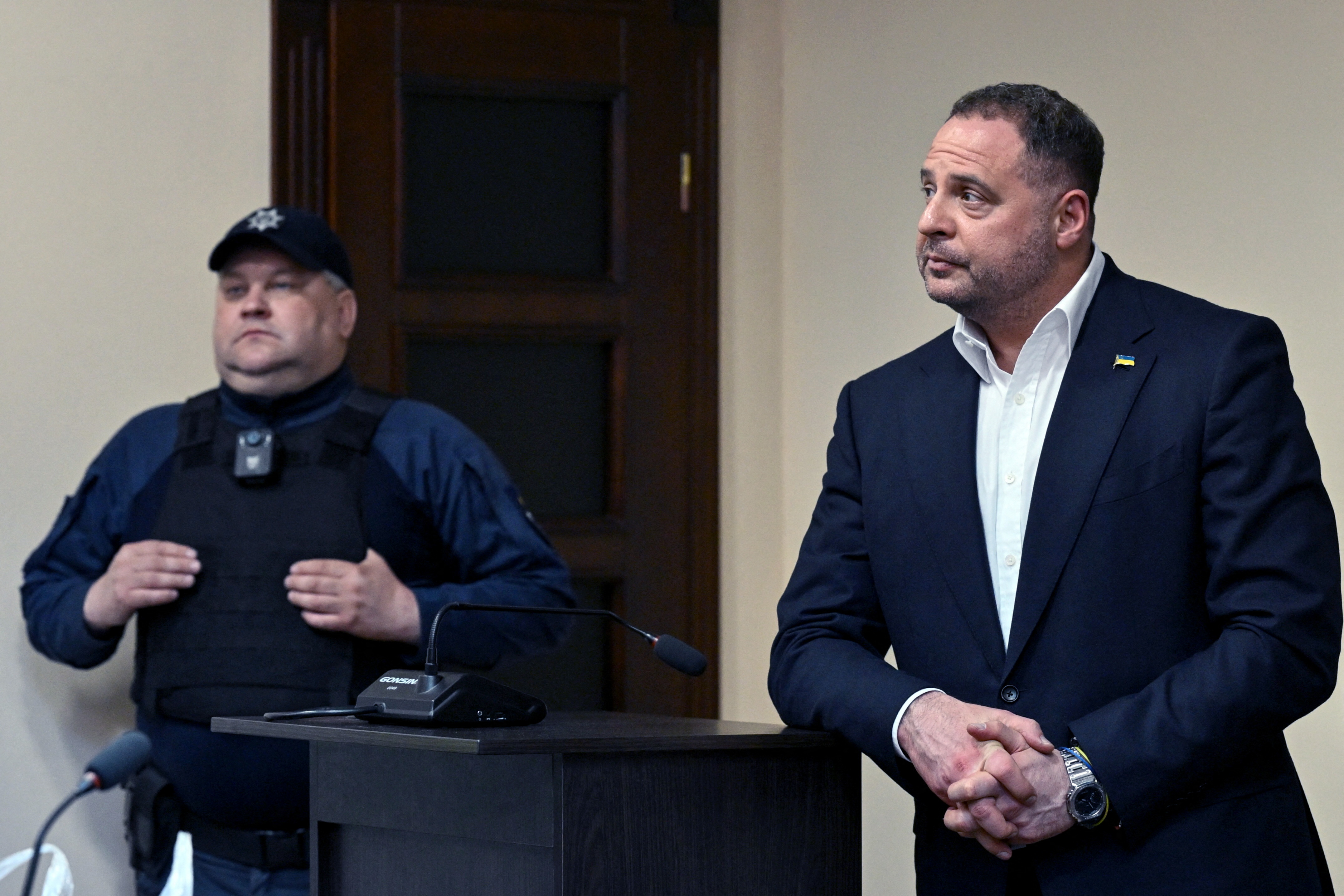 Ukraine's former Presidential Office Chief of staff Andriy Yermak (R), stands in court before a hearing in a money laundering case, to determine a preventive measure, in Kyiv on May 12, 2026, amid the Russian invasion of Ukraine.