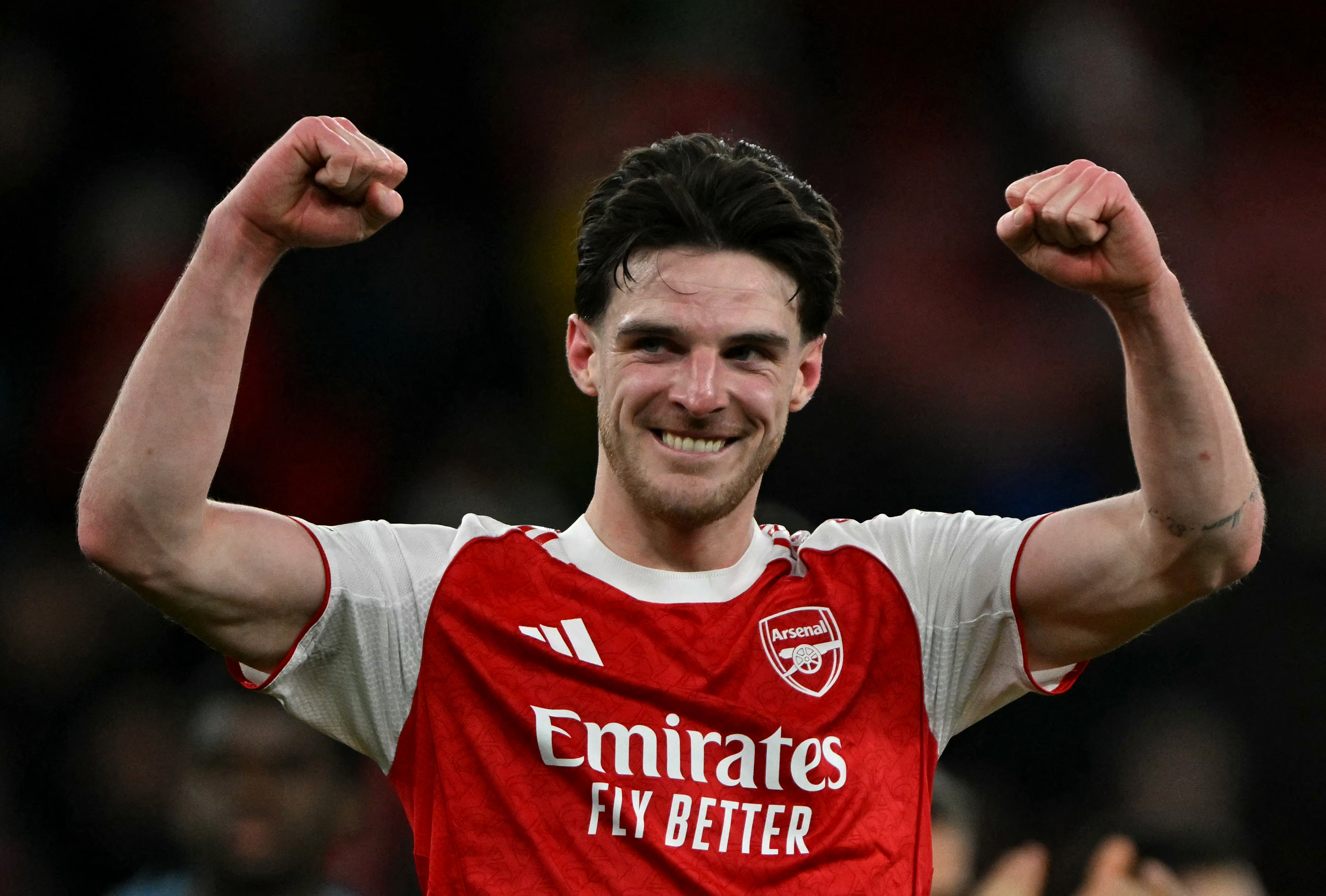 (FILES) Arsenal's English midfielder #41 Declan Rice celebrates at the final whistle during the UEFA Champions League, last 16 second leg football match between Arsenal and Bayer Leverkusen at the Emirates Stadium in north London on March 17, 2026.