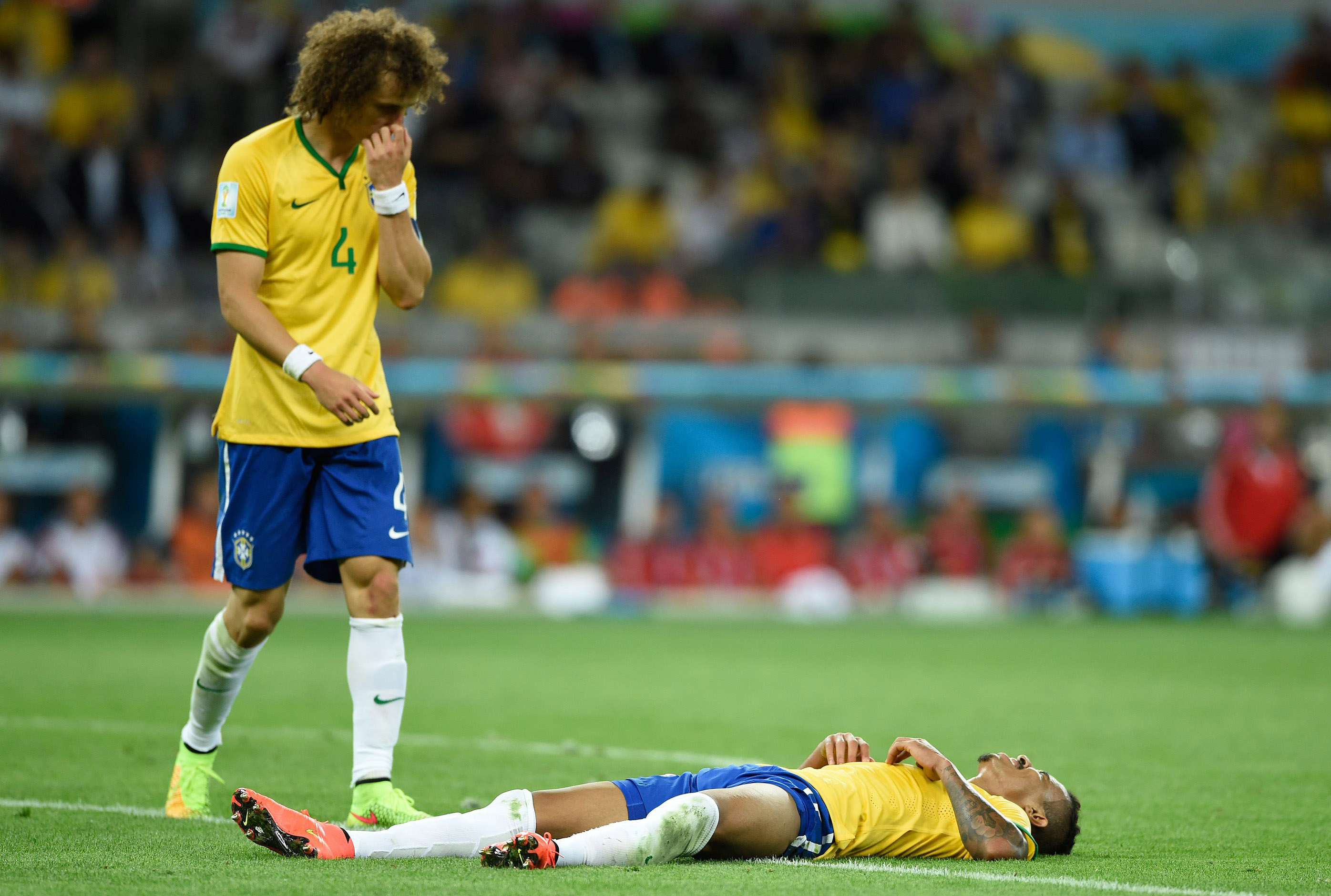 July 8, 2014; Belo Horizonte, BRAZIL; Brazil players David Luiz (4) and Luiz Gustavo (right) react after the semifinal match against Germany in the 2014 World Cup at Mineirao Stadium. Mandatory Credit: Tim Groothuis/Witters Sport via USA TODAY Sports