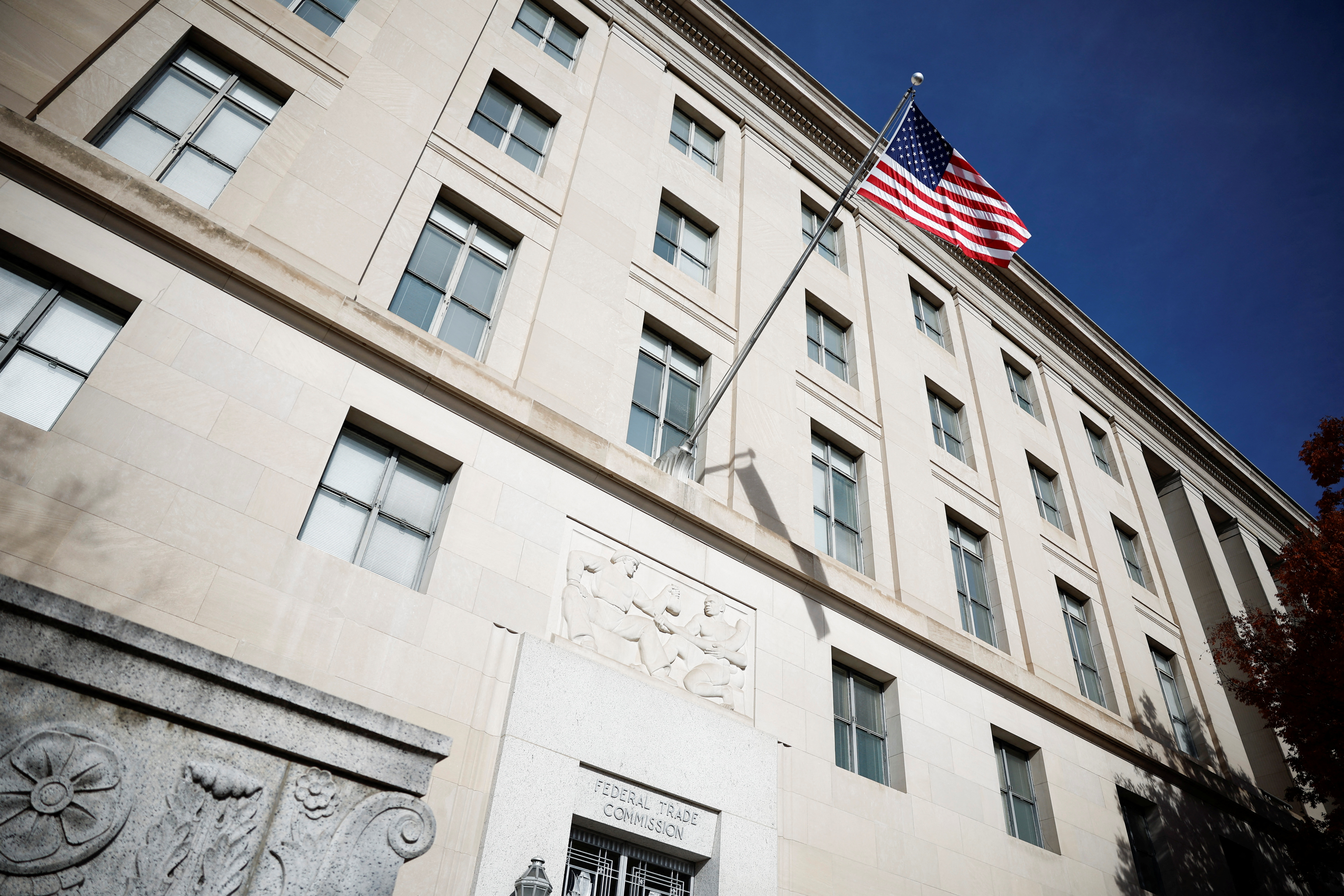 A US flag flutters at the Federal Trade Commission headquarters in Washington, DC, the US, on November 24, 2024