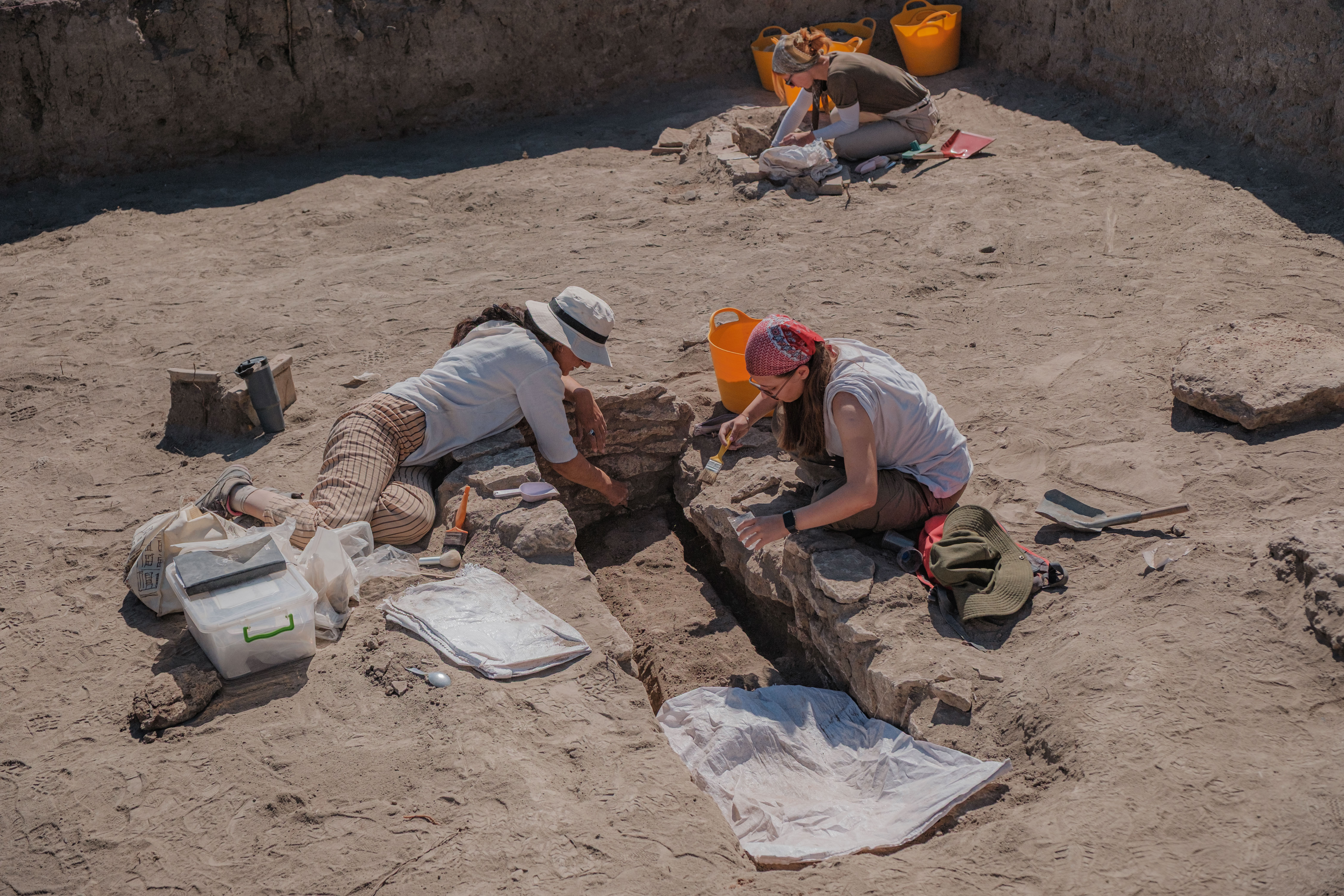 Archaeologists are seen working at the excavation site [Can Erok/Al Jazeera]