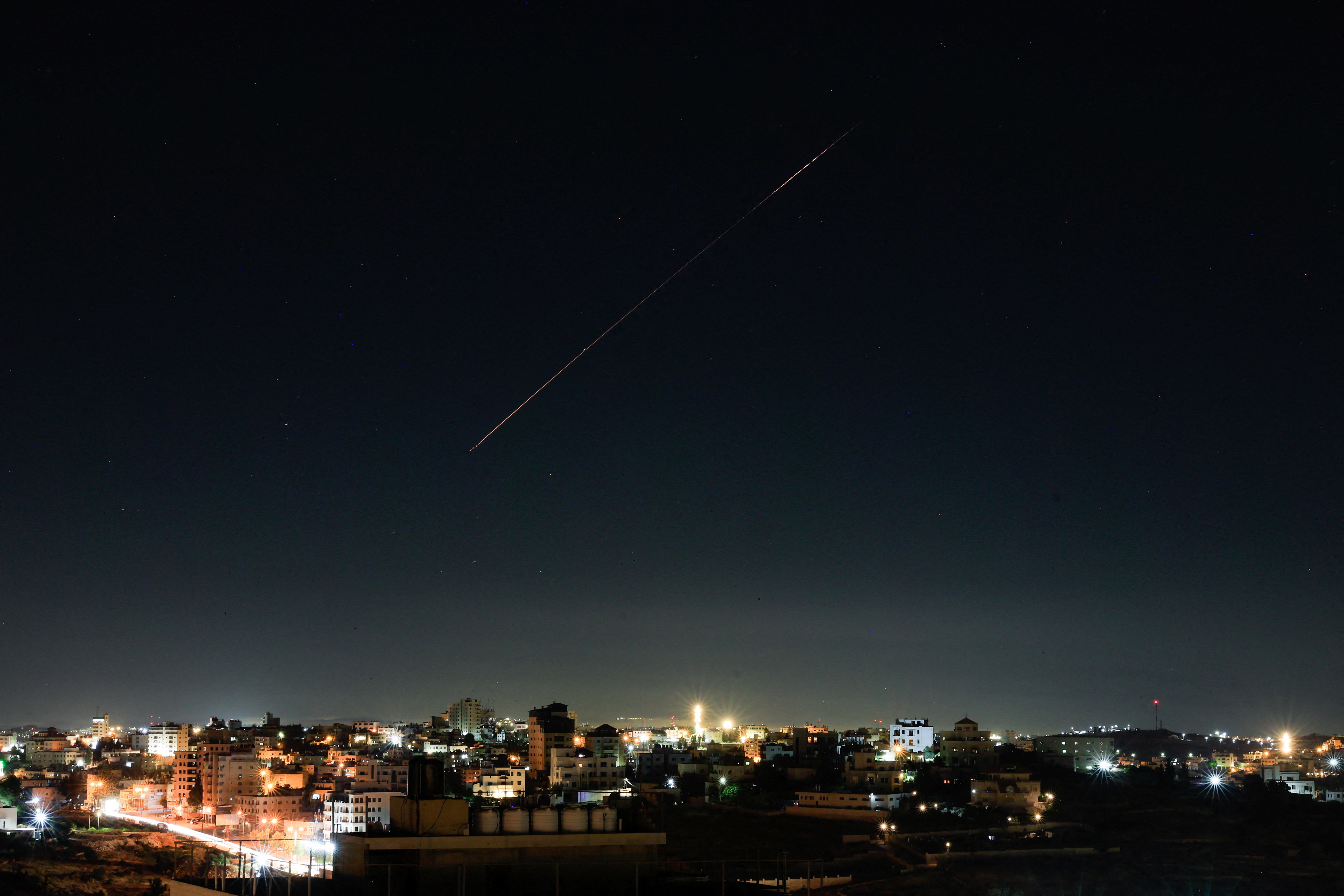 An Israeli air-defence missile flies in the sky over Israel, as seen from Hebron, in the Israeli-occupied West Bank, June 7, 2026. REUTERS/Mussa Qawasma