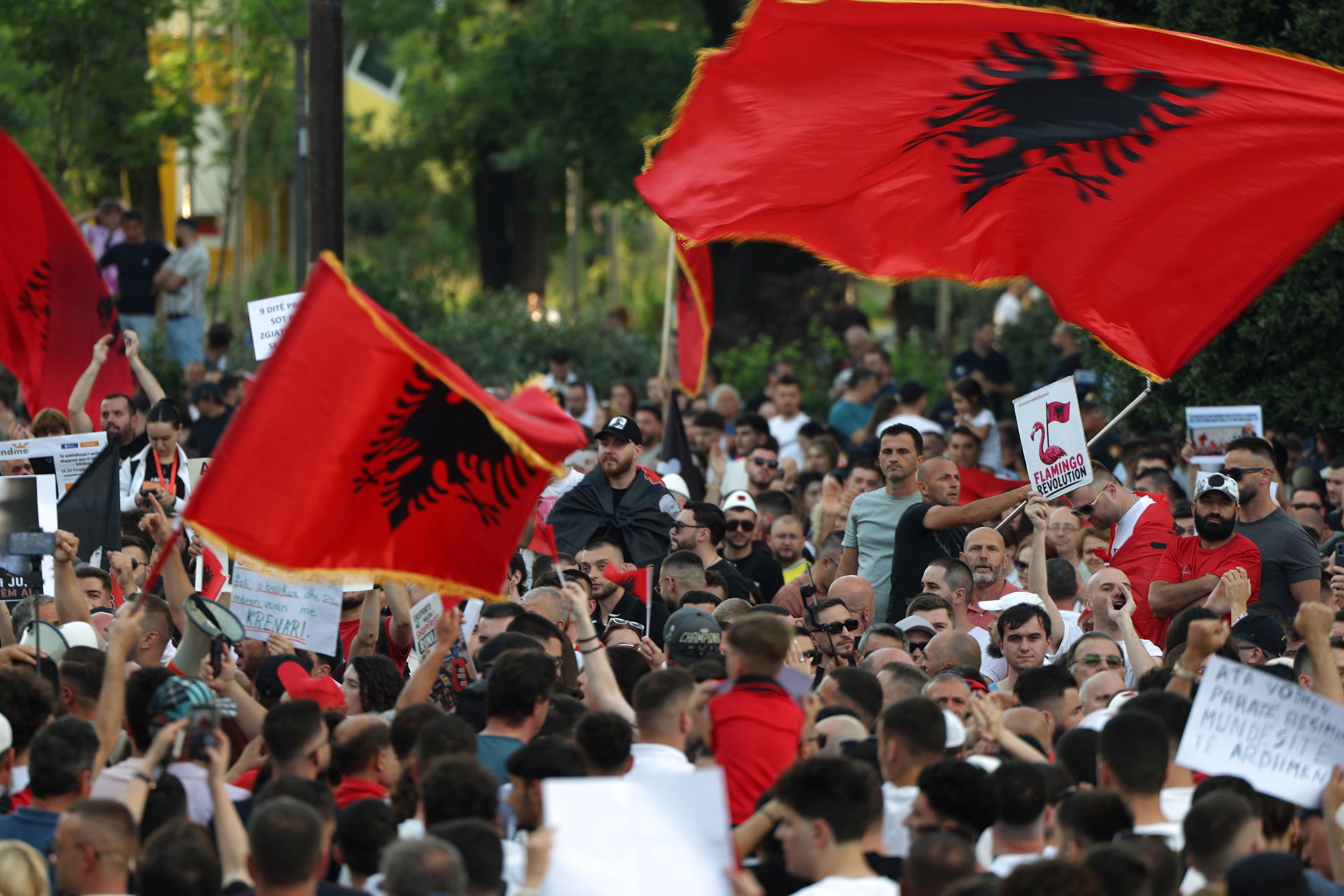 Demonstrators wave Albanian flags during a protest against a luxury resort, a plan by a company linked to U.S. President Donald Trump's son-in-law, Jared Kushner, on an environmentally sensitive part of the Adriatic coast, in Tirana, Albania, June 8, 2026.